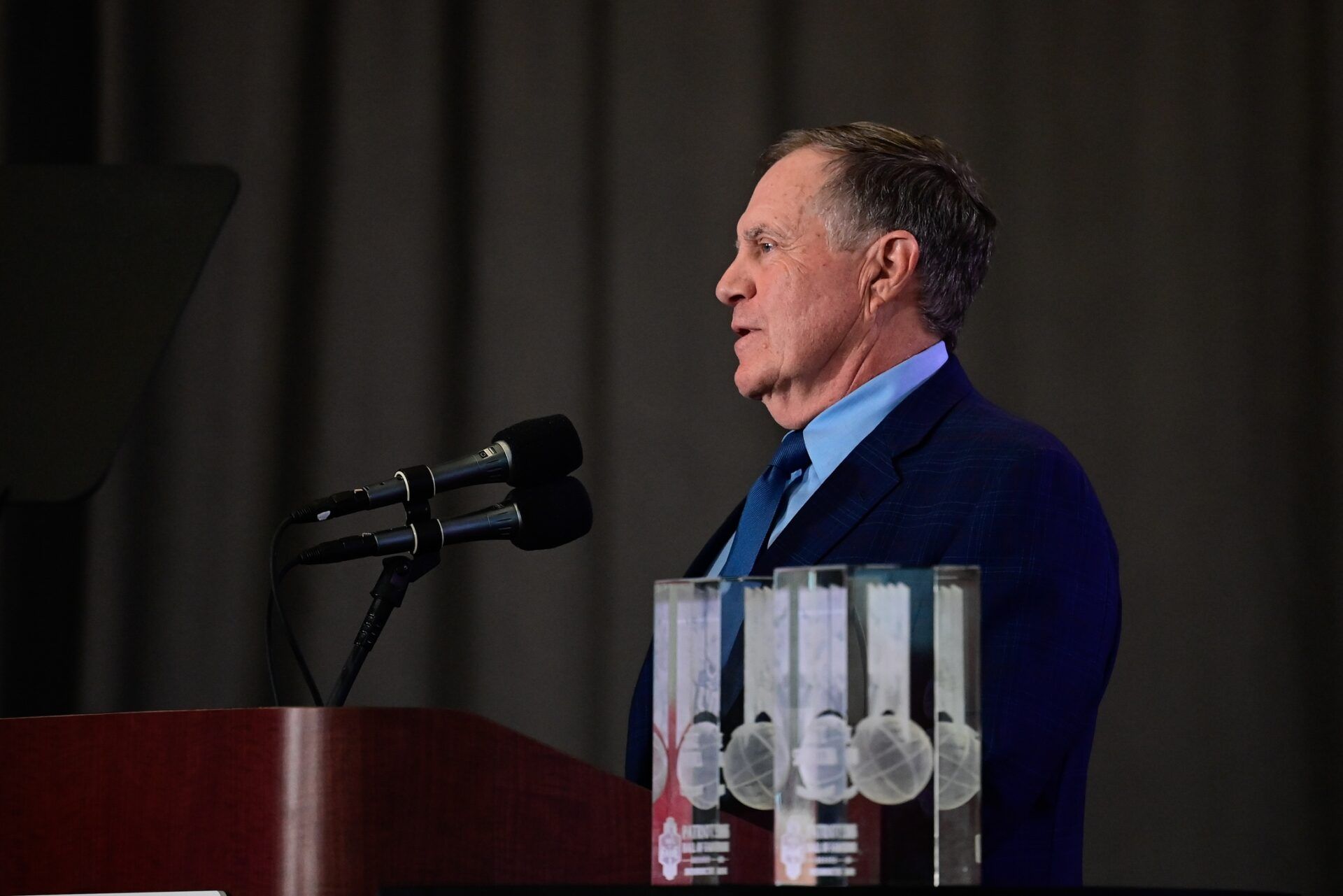 New England Patriots head coach Bill Belichick gives a speech at the 2023 Patriots Hall of Fame induction in the Cross Insurance Pavilion at Gillette Stadium.