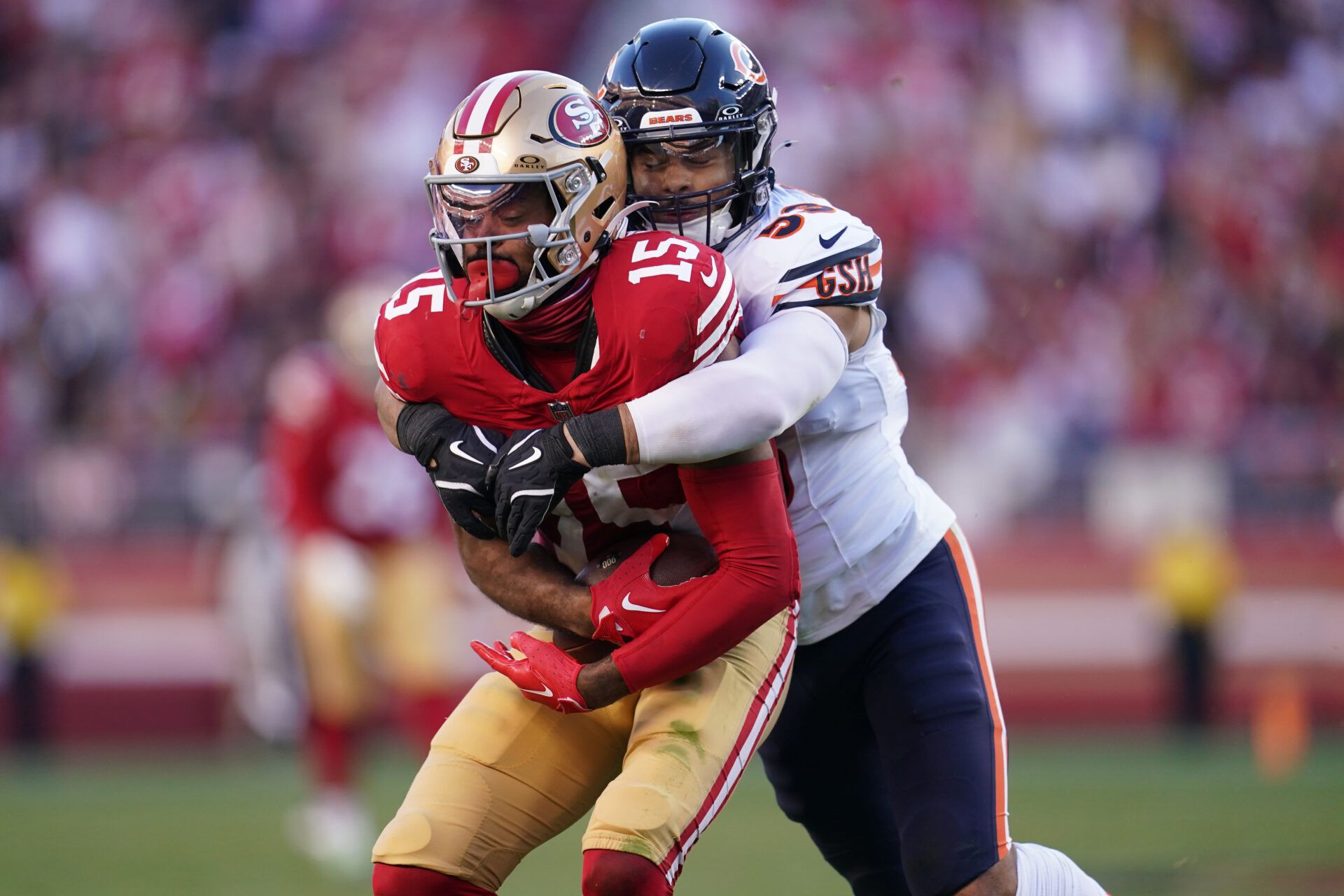 Dec 8, 2024; Santa Clara, California, USA; San Francisco 49ers wide receiver Jauan Jennings (15) holds onto the ball after making a catch for a first down in front of Chicago Bears linebacker T.J. Edwards (53) in the third quarter at Levi's Stadium. Mandatory Credit: Cary Edmondson-Imagn Images