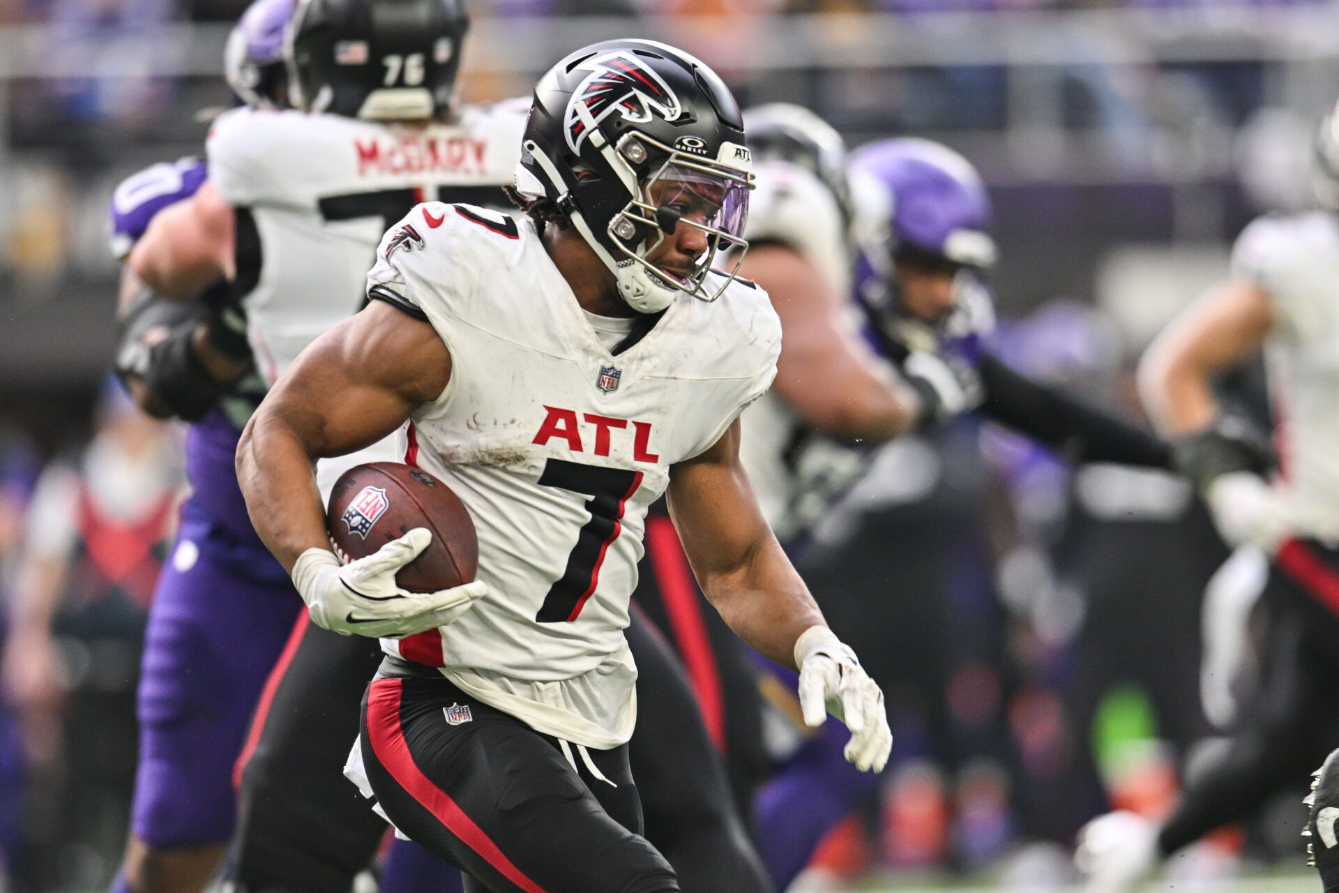 Dec 8, 2024; Minneapolis, Minnesota, USA; Atlanta Falcons running back Bijan Robinson (7) runs the ball against the Minnesota Vikings during the second quarter at U.S. Bank Stadium. Mandatory Credit: Jeffrey Becker-Imagn Images