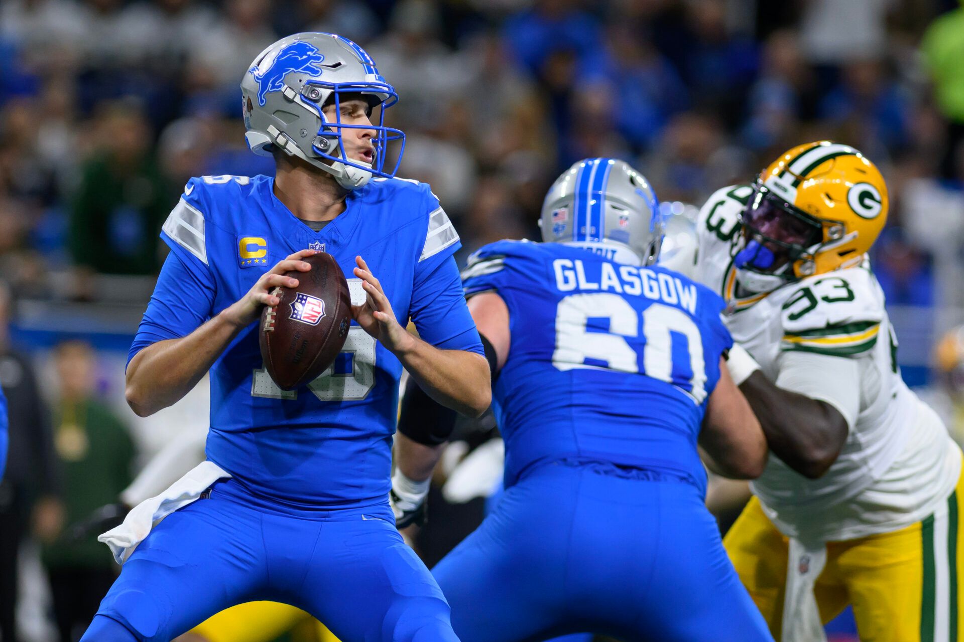 Dec 5, 2024; Detroit, Michigan, USA; Detroit Lions quarterback Jared Goff (16) looks to throw a pass against the Green Bay Packers in the first quarter at Ford Field. Mandatory Credit: Lon Horwedel-Imagn Images