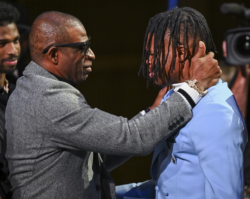 WATCH: NFL Bound Travis Hunter and Deion Sanders Share Heartfelt Moment as Draft Prospect Wins Heisman Award