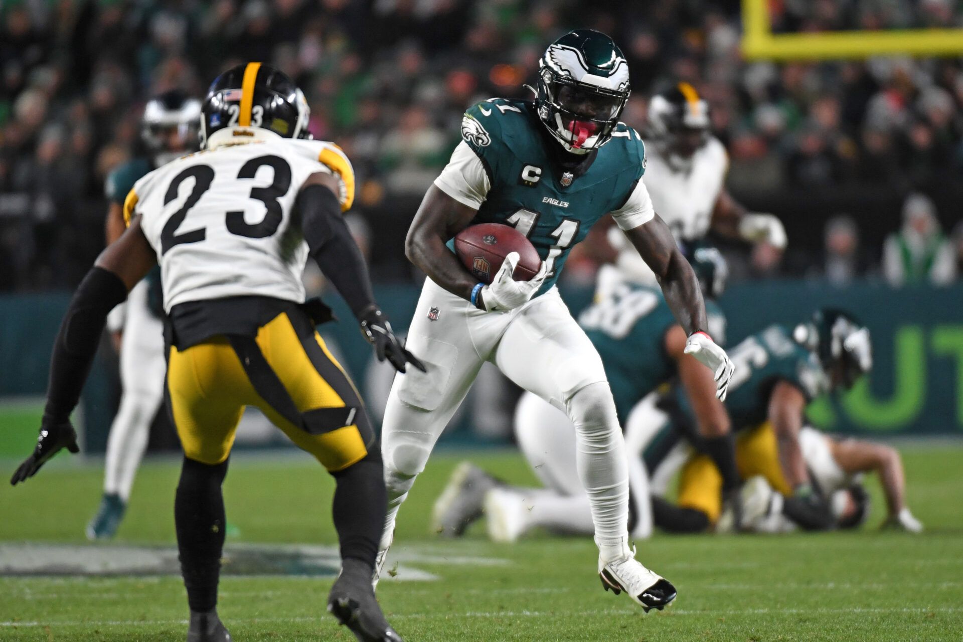 Philadelphia Eagles wide receiver A.J. Brown (11) picks up yards after catch against Pittsburgh Steelers safety Damontae Kazee (23) during the second quarter at Lincoln Financial Field.