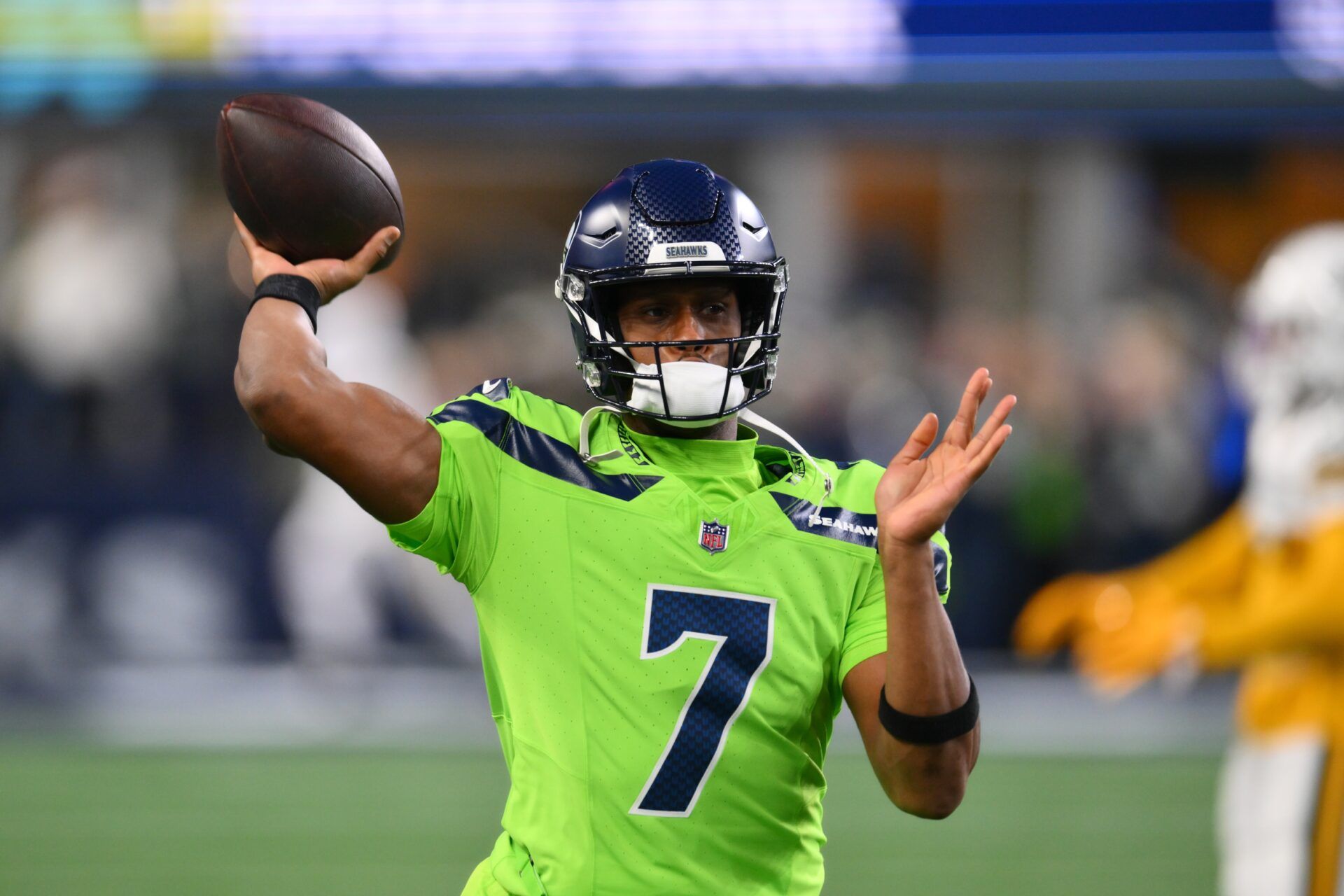 Seattle Seahawks quarterback Geno Smith (7) throws the ball during warmups before the game against the Green Bay Packers at Lumen Field.