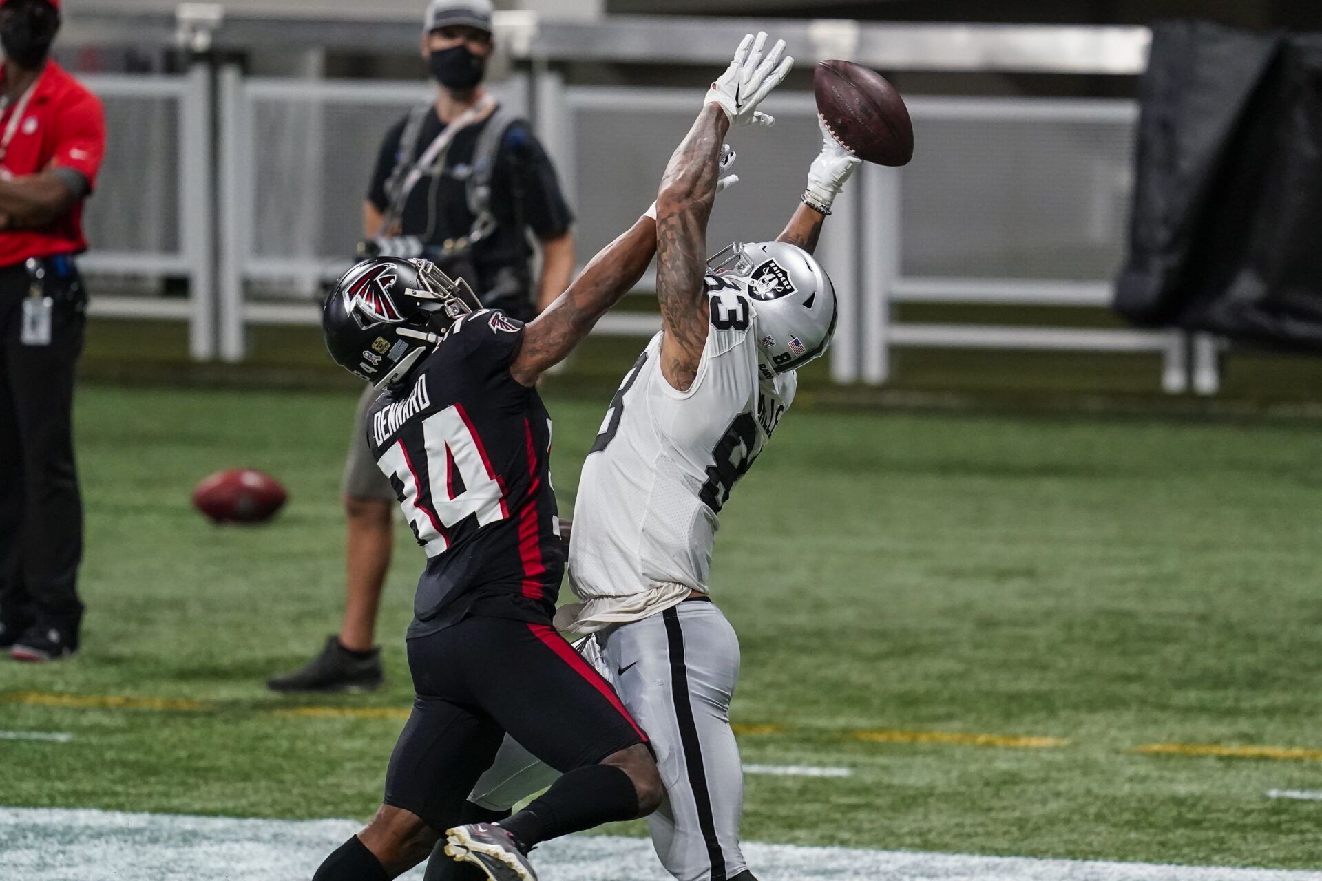 Atlanta Falcons cornerback Darqueze Dennard (34) breaks up a pass against Las Vegas Raiders tight end Darren Waller (83) during the first half at Mercedes-Benz Stadium.