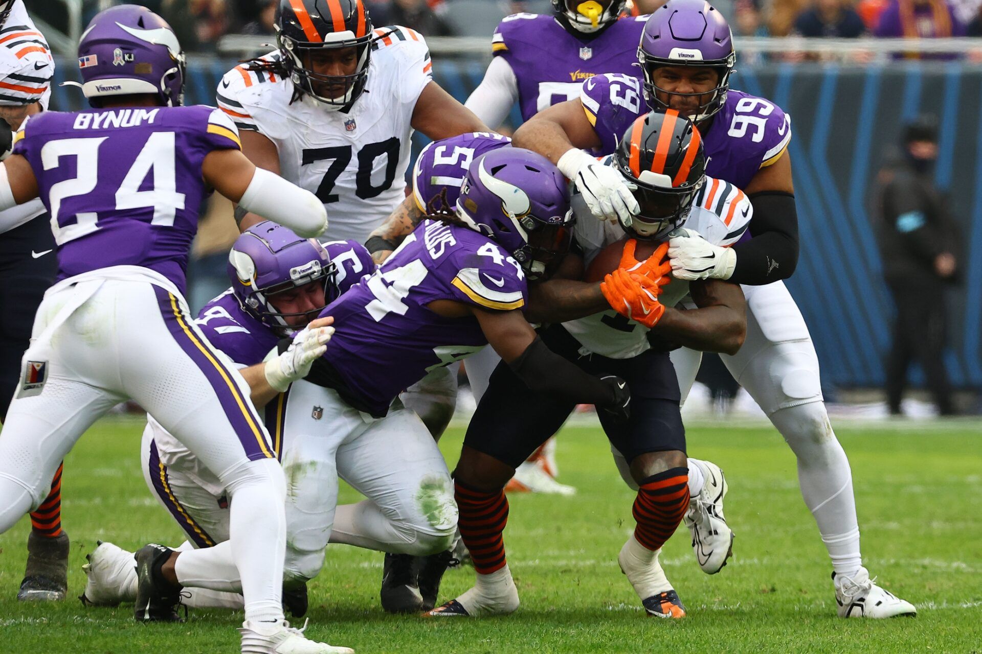 Chicago Bears running back D'Andre Swift (4) rushes the ball against Minnesota Vikings defensive tackle Jerry Tillery (99) and safety Josh Metellus (44) during the second half at Soldier Field.