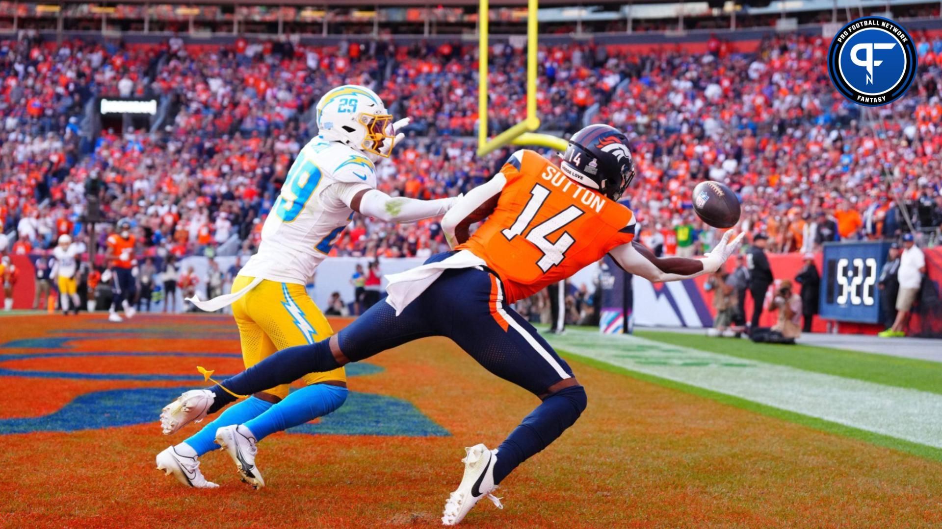 Denver Broncos wide receiver Courtland Sutton (14) pulls in a touchdown past Los Angeles Chargers cornerback Tarheeb Still (29) in the second half at Empower Field at Mile High.