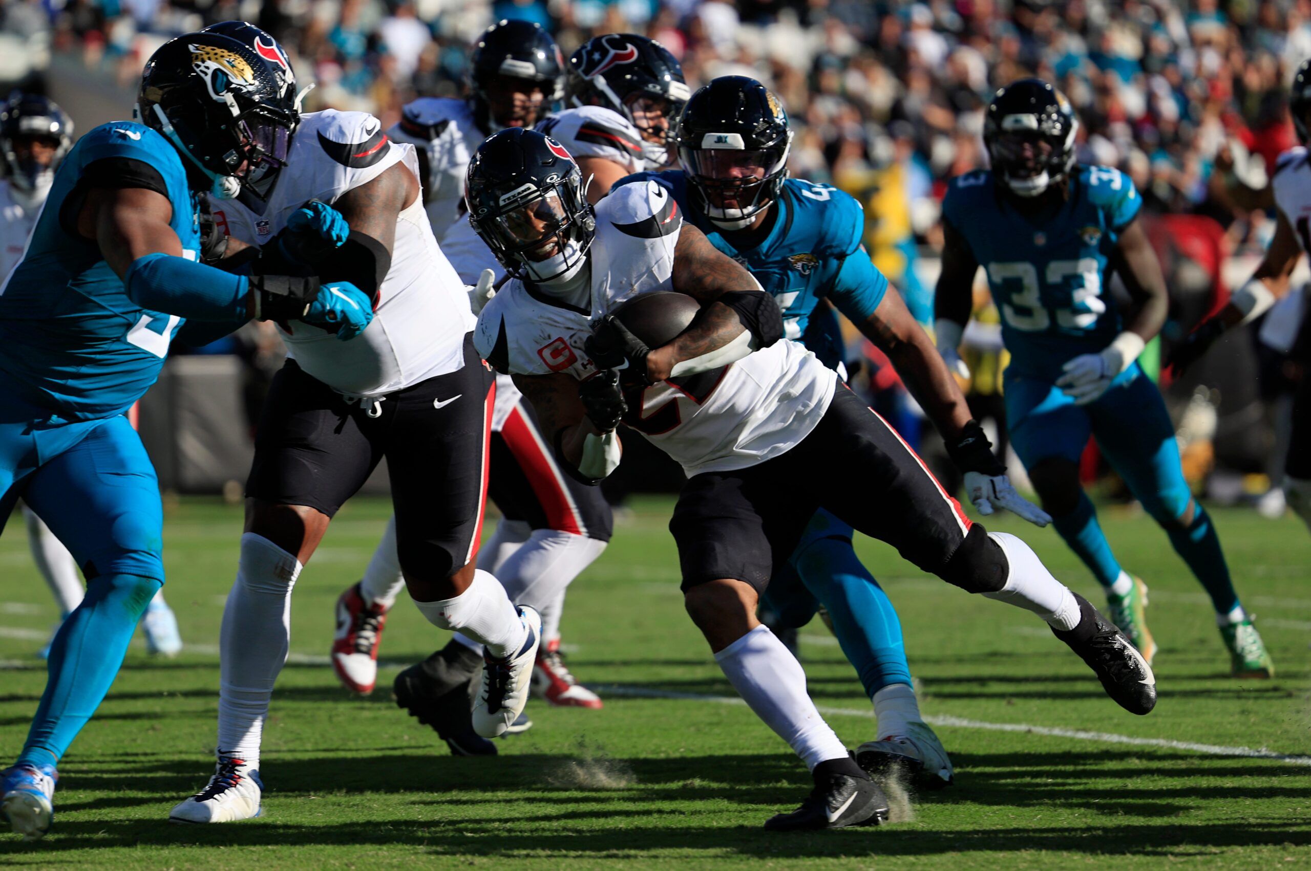 Houston Texans running back Joe Mixon (28) scores a touchdown during the third quarter of an NFL football matchup Sunday, Dec. 1, 2024 at EverBank Stadium in Jacksonville, Fla. The Texans held off the Jaguars 23-20. [Corey Perrine/Florida Times-Union]