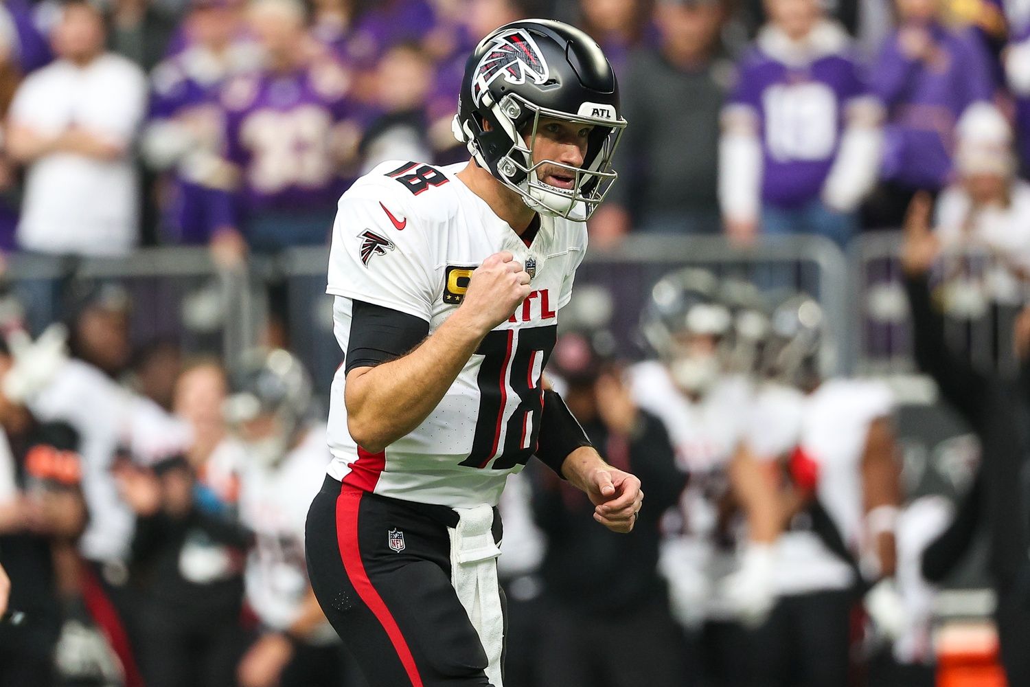 Atlanta Falcons quarterback Kirk Cousins (18) celebrates running back Tyler Allgeier's (25) touchdown against the Minnesota Vikings during the first quarter at U.S. Bank Stadium.