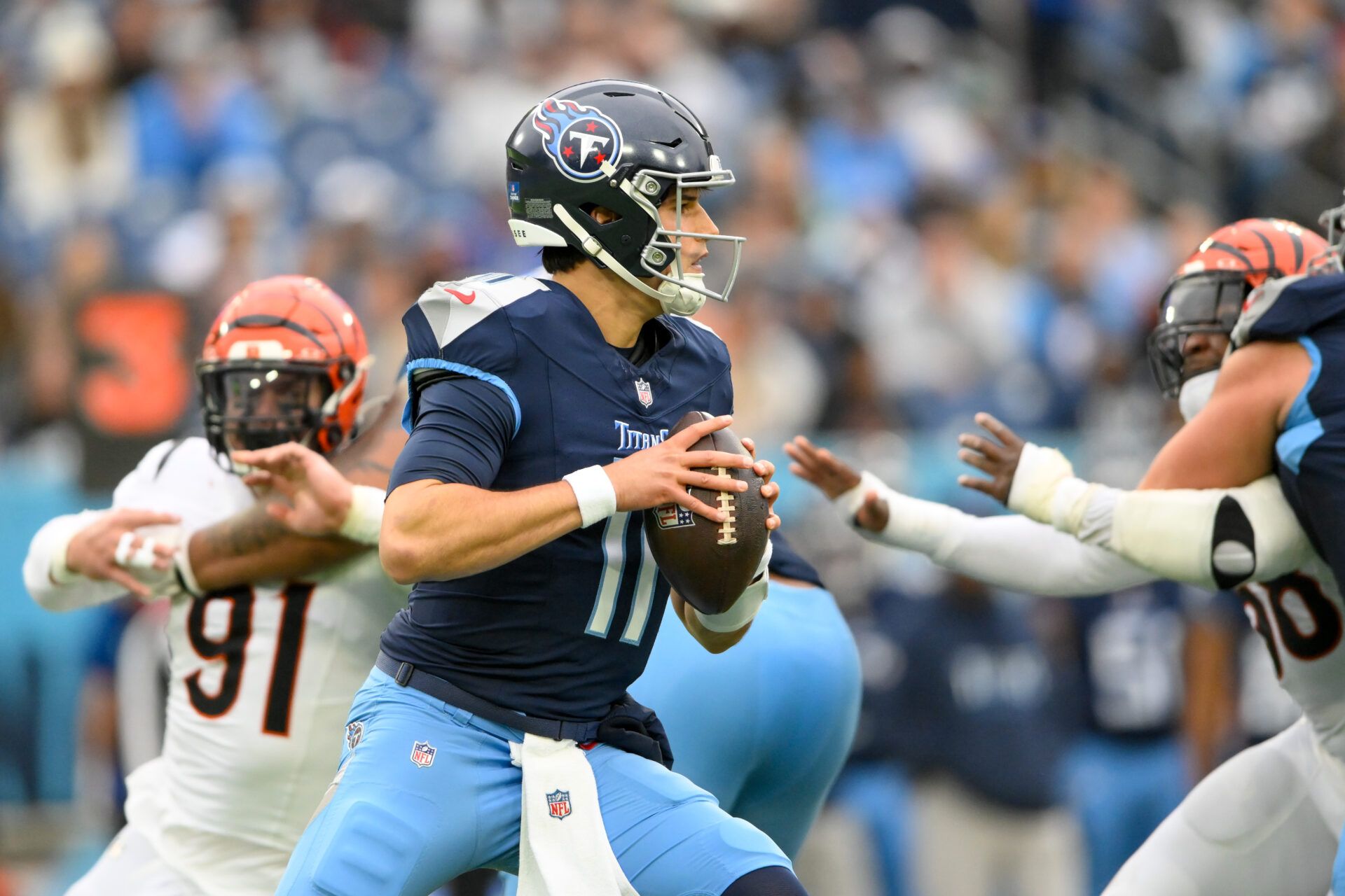 Dec 15, 2024; Nashville, Tennessee, USA; Tennessee Titans quarterback Mason Rudolph (11) stands in the pocket against the Cincinnati Bengals during the second half at Nissan Stadium. Mandatory Credit: Steve Roberts-Imagn Images