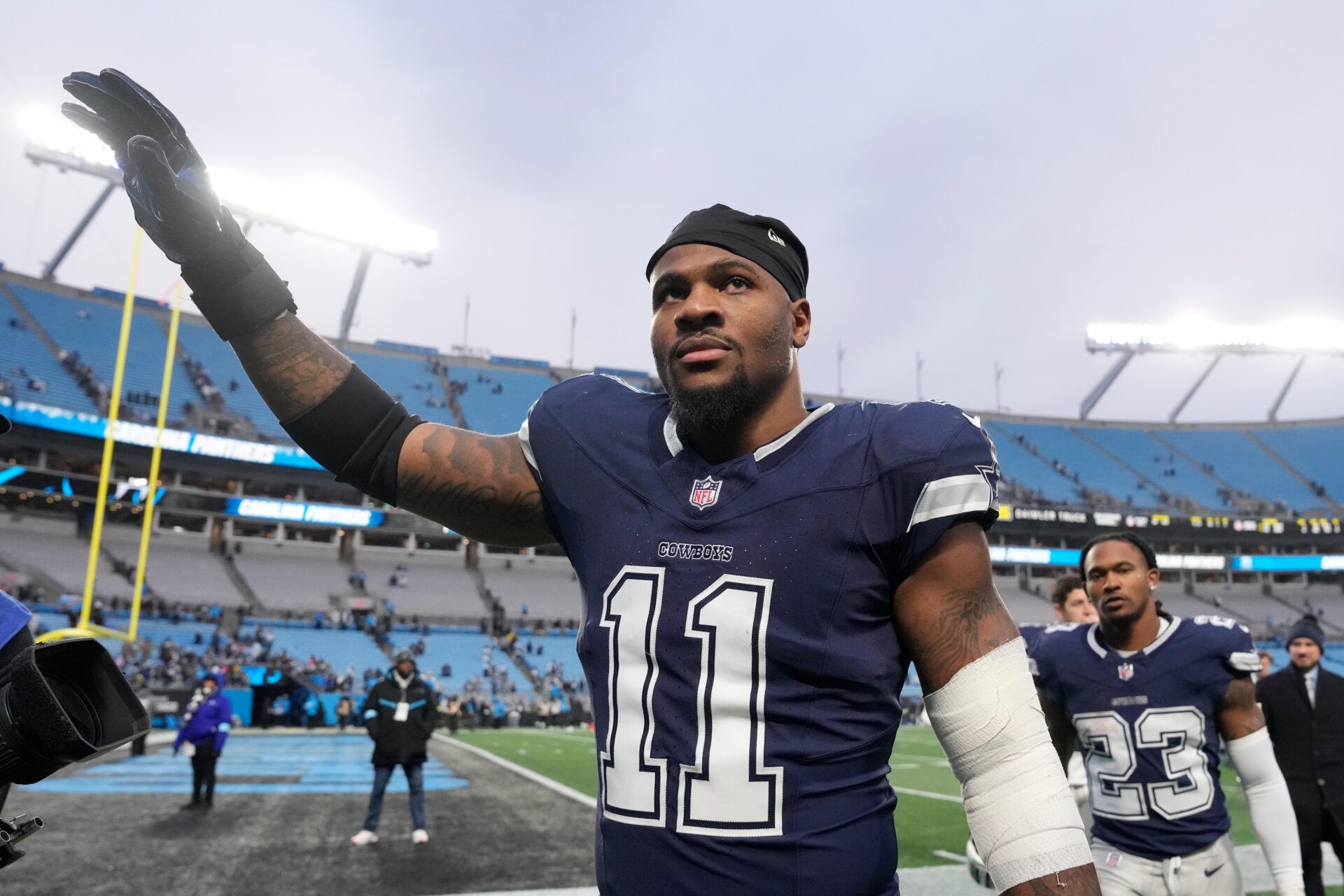 Dallas Cowboys linebacker Micah Parsons (11) walks off the field after the game at Bank of America Stadium.