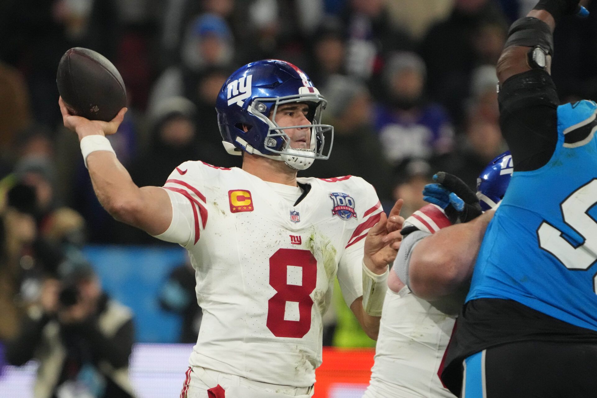 Nov 10, 2024; Munich, Germany; New York Giants quarterback Daniel Jones (8) throws the ball against the Carolina Panthers in the second half during the 2024 NFL Munich Game at Allianz Arena. Mandatory Credit: Kirby Lee-Imagn Images