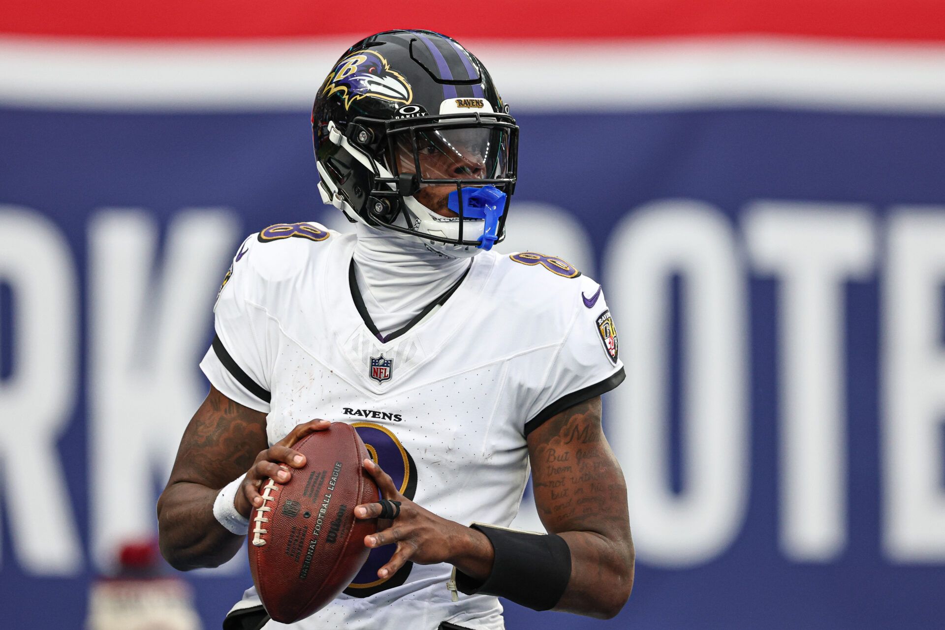 Dec 15, 2024; East Rutherford, New Jersey, USA; Baltimore Ravens quarterback Lamar Jackson (8) drops back to pass during the second half against the New York Giants at MetLife Stadium. Mandatory Credit: Vincent Carchietta-Imagn Images