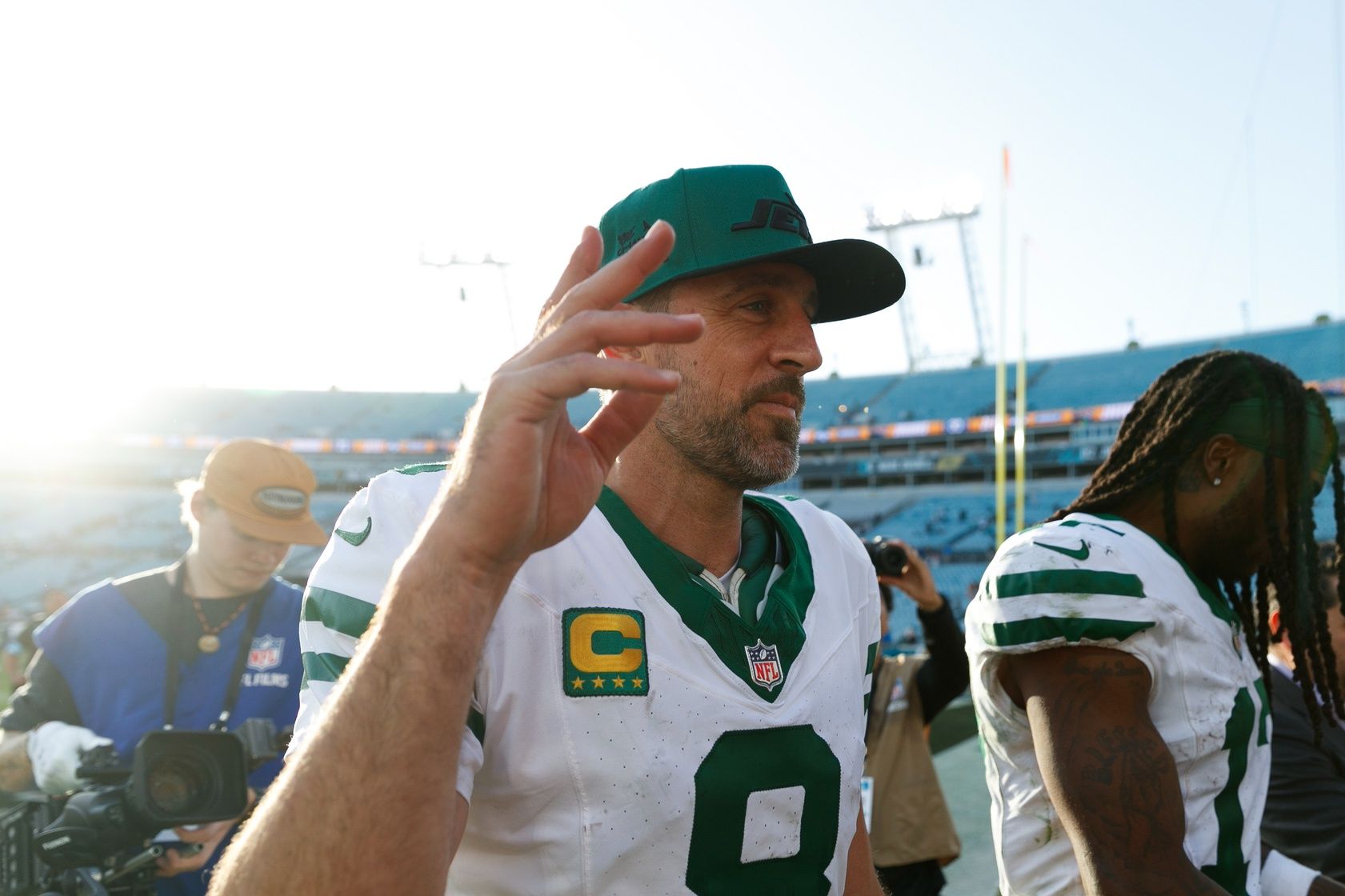 New York Jets quarterback Aaron Rodgers (8) waves to fans after the game against the Jacksonville Jaguars at EverBank Stadium.