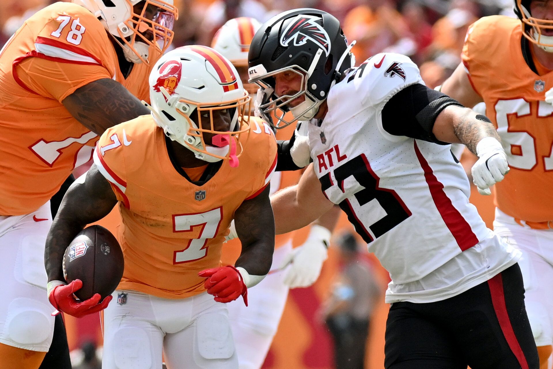 Oct 27, 2024; Tampa, Florida, USA; Atlanta Falcons linebacker Nate Landman (53) attempted to tackle Tampa Bay Buccaneers running back Bucky Irving (7) in the first quarter against the Atlanta Falcons at Raymond James Stadium. Mandatory Credit: Jonathan Dyer-Imagn Images