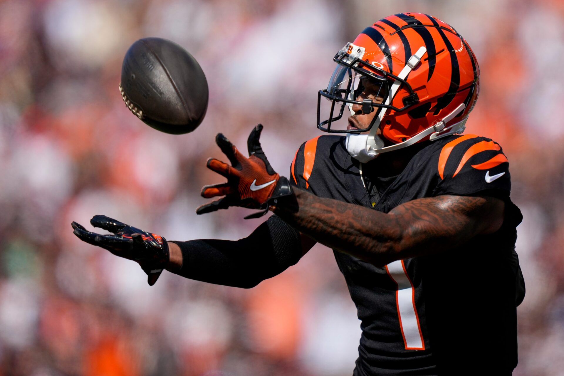 Cincinnati Bengals wide receiver Ja'Marr Chase (1) catches a deep pass for a touchdown in the second quarter of the NFL Week 5 game between the Cincinnati Bengals and Baltimore Ravens at Paycor Stadium in downtown Cincinnati on Sunday, Oct. 6, 2024. The Bengals led 17-14 at halftime.