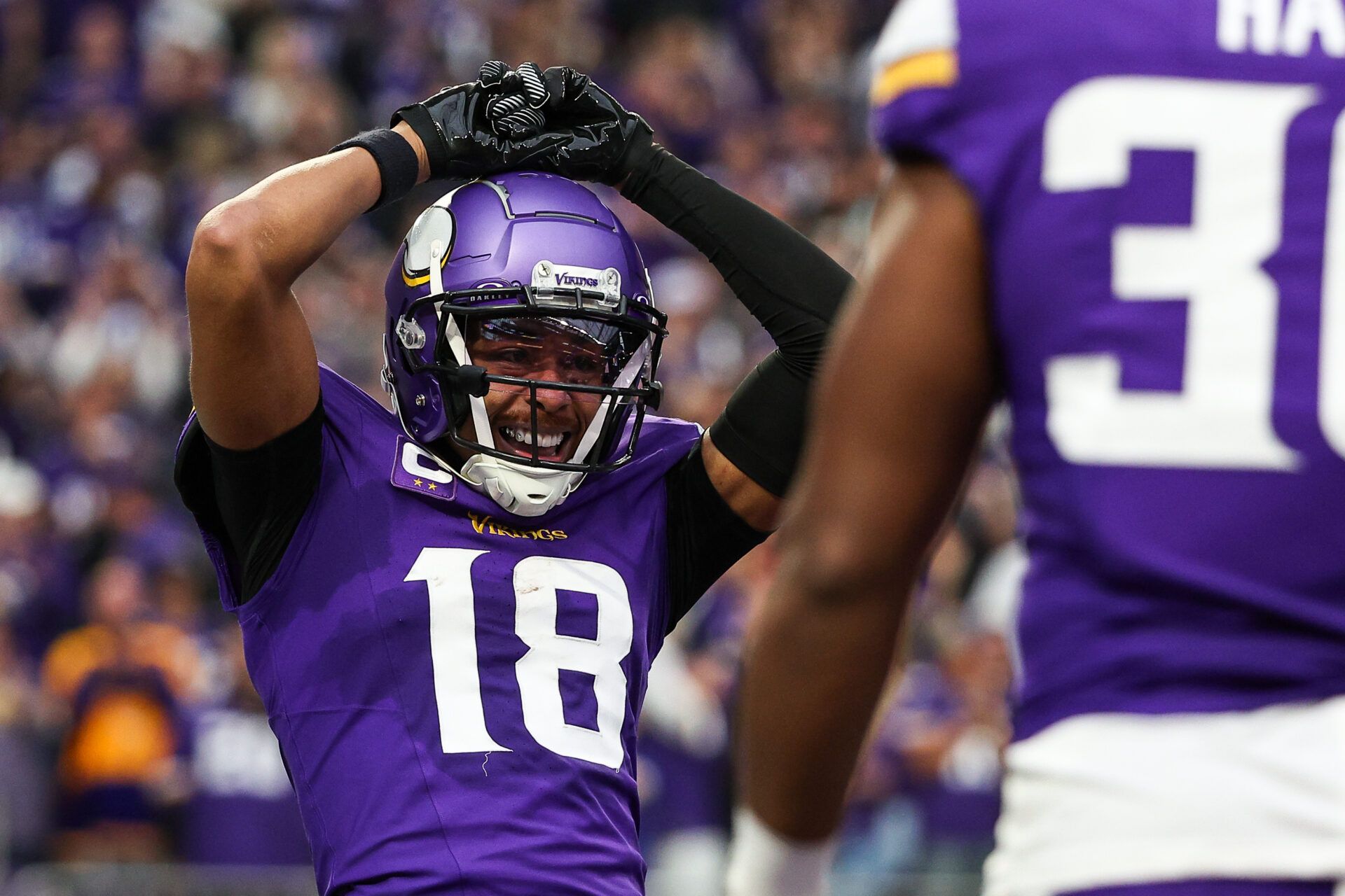 Dec 8, 2024; Minneapolis, Minnesota, USA; Minnesota Vikings wide receiver Justin Jefferson (18) celebrates his touchdown against the Atlanta Falcons during the third quarter at U.S. Bank Stadium. Mandatory Credit: Matt Krohn-Imagn Images