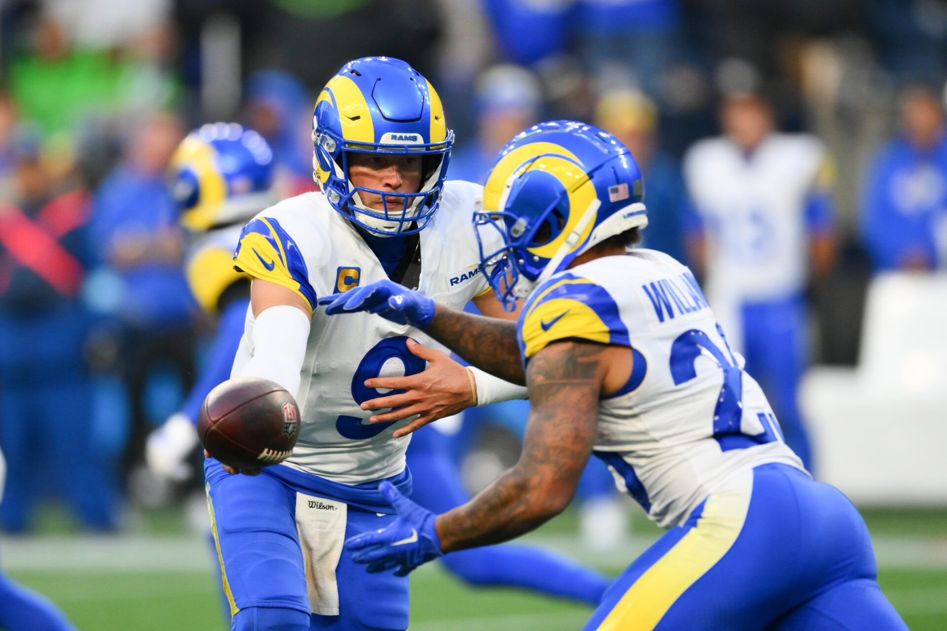 Nov 3, 2024; Seattle, Washington, USA; Los Angeles Rams quarterback Matthew Stafford (9) hands the ball off to running back Kyren Williams (23) during the second half against the Seattle Seahawks at Lumen Field. Mandatory Credit: Steven Bisig-Imagn Images