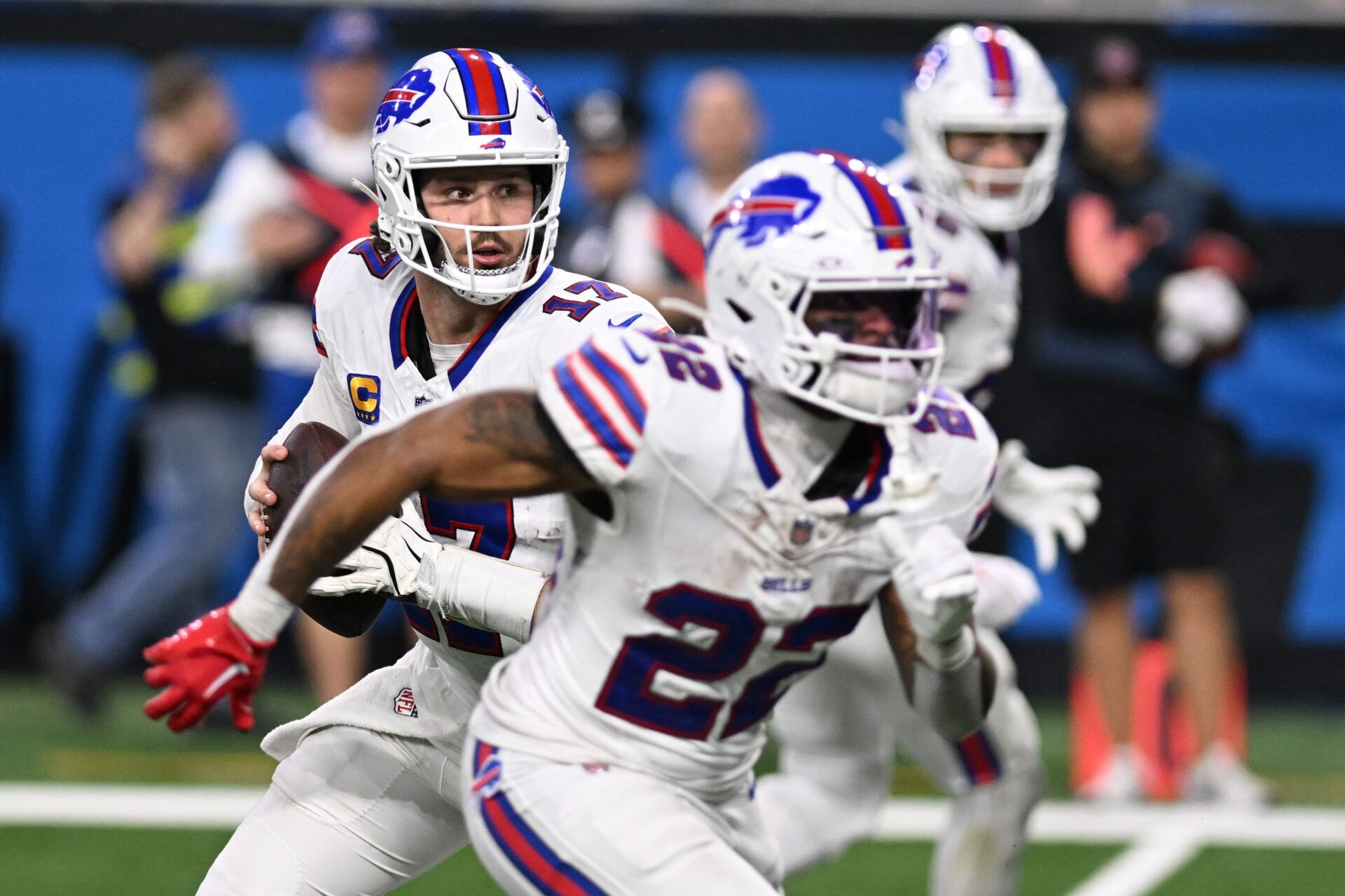 Dec 15, 2024; Detroit, Michigan, USA; Buffalo Bills quarterback Josh Allen (17) rolls out of the pocket before throwing a touchdown pass against the Detroit Lions in the fourth quarter at Ford Field. Mandatory Credit: Lon Horwedel-Imagn Images