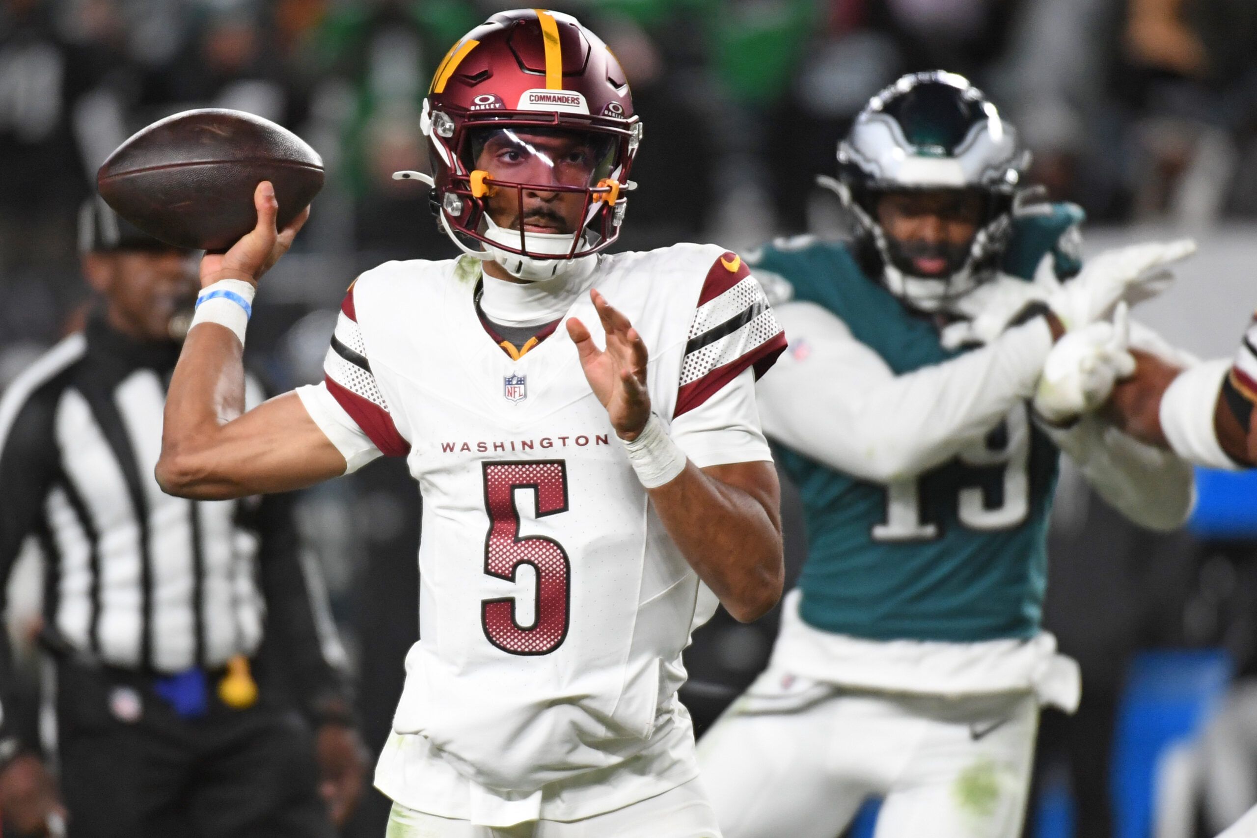 Nov 14, 2024; Philadelphia, Pennsylvania, USA; Washington Commanders quarterback Jayden Daniels (5) throws a pass during the fourth quarter against the Philadelphia Eagles at Lincoln Financial Field. Mandatory Credit: Eric Hartline-Imagn Images