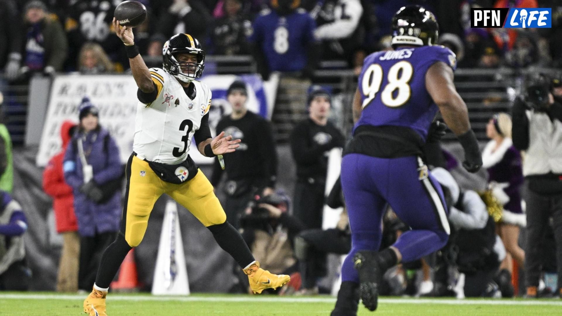 Pittsburgh Steelers quarterback Russell Wilson (3) throws on the run as Baltimore Ravens defensive tackle Travis Jones (98) defends during the first half at M&T Bank Stadium.