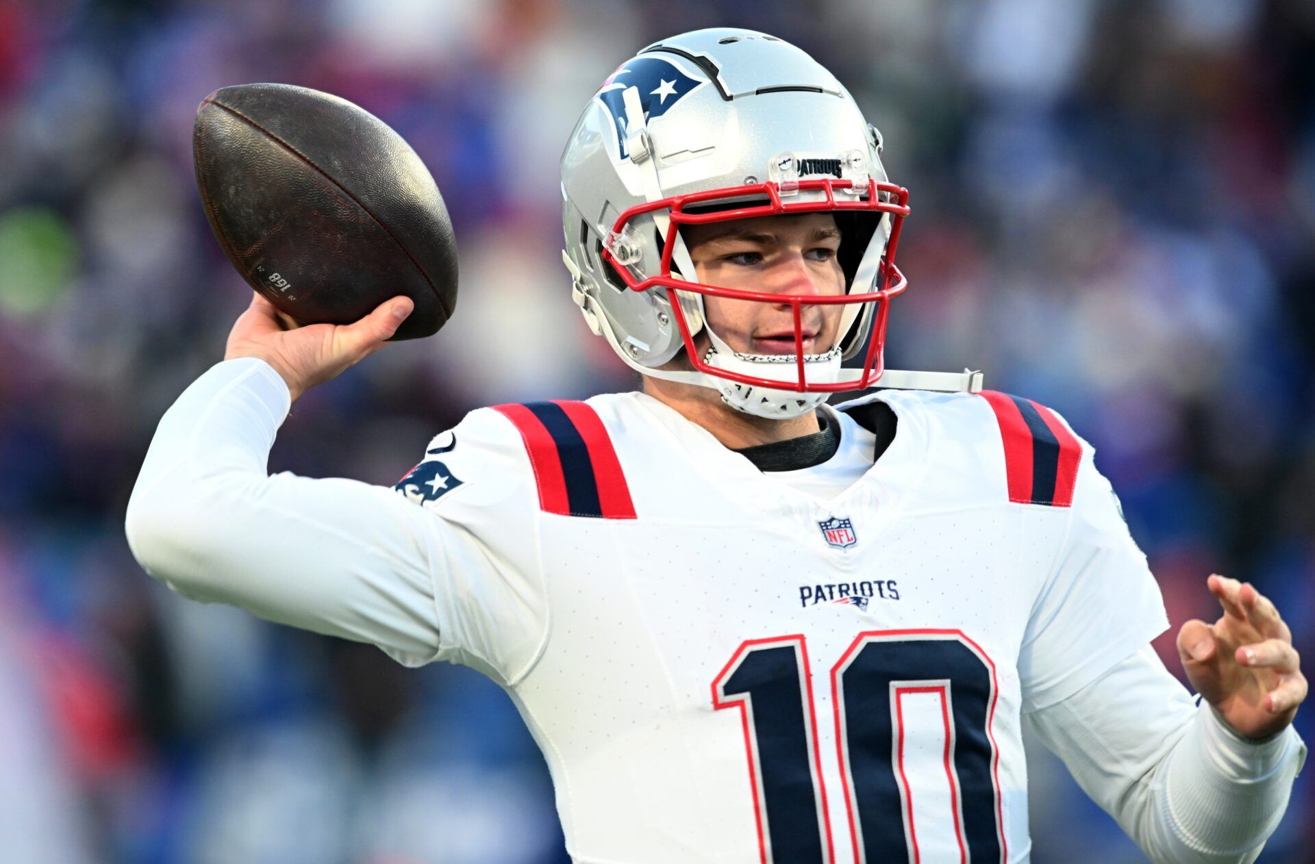 New England Patriots quarterback Drake Maye (10) warms up before a game against the Buffalo Bills at Highmark Stadium.