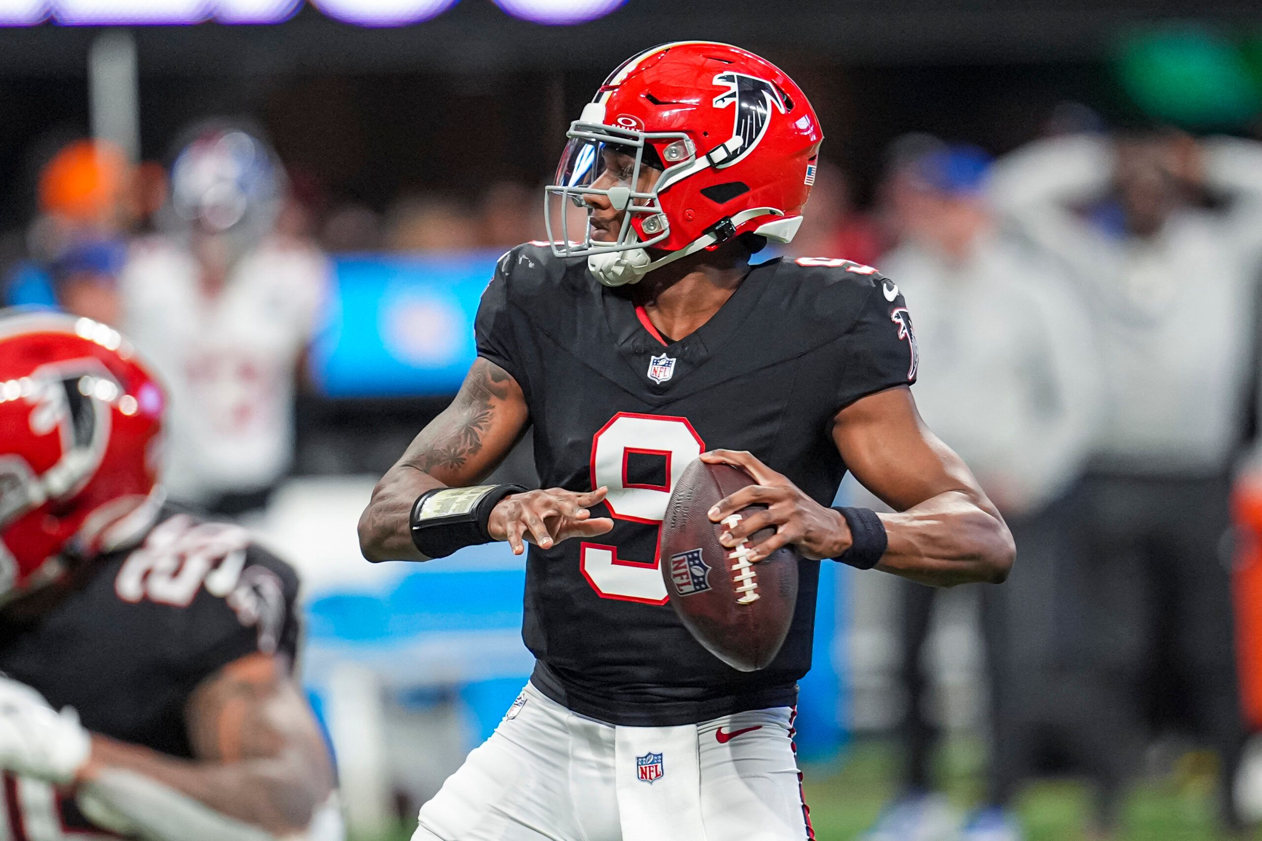 Dec 22, 2024; Atlanta, Georgia, USA; Atlanta Falcons quarterback Michael Penix Jr. (9) looks for a receiver against the New York Giants during the second half at Mercedes-Benz Stadium. Mandatory Credit: Dale Zanine-Imagn Images