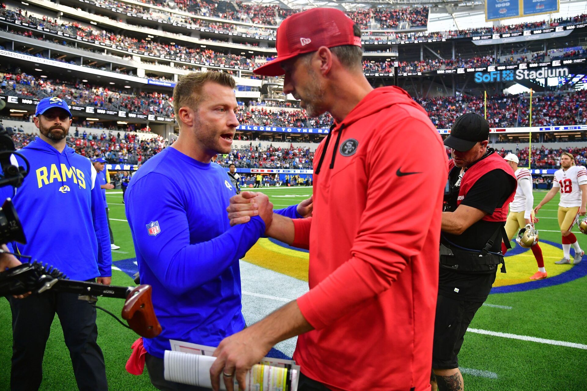 Los Angeles Rams head coach Sean McVay meets with San Francisco 49ers head coach Kyle Shanahan following the game at SoFi Stadium.