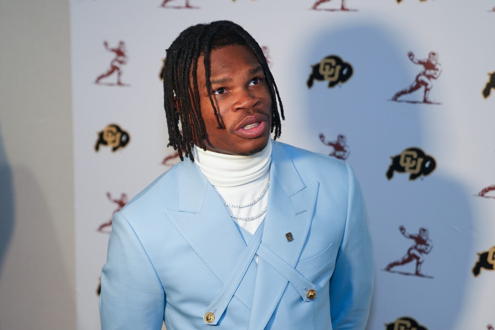 Colorado Buffaloes wide receiver/cornerback Travis Hunter answers questions during media interviews before the 2024 Heisman Trophy Presentation.