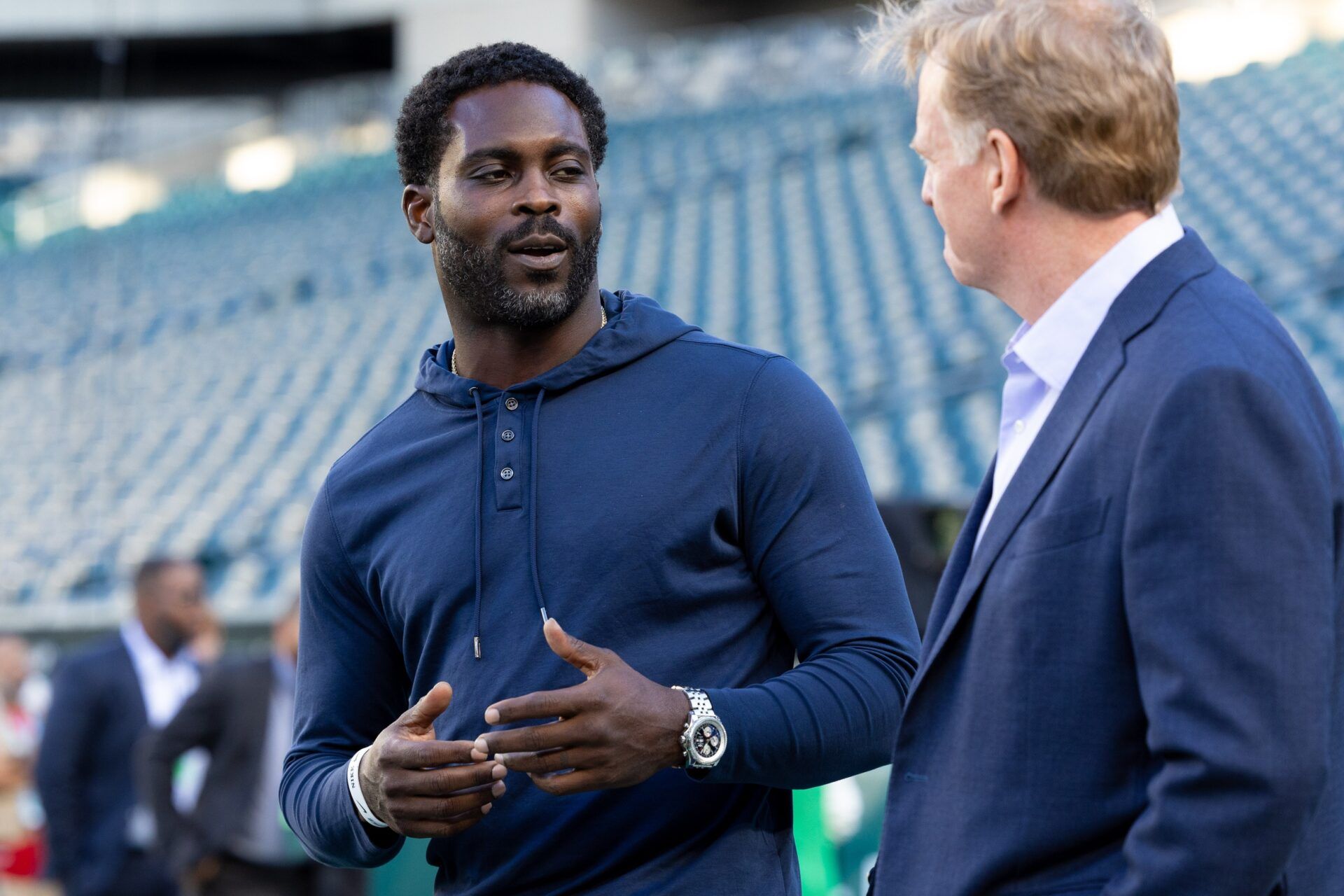 NFL commissioner Roger Goodell (R) talks with former player Michael Vick (L) before a game between the Philadelphia Eagles and the Minnesota Vikings at Lincoln Financial Field.