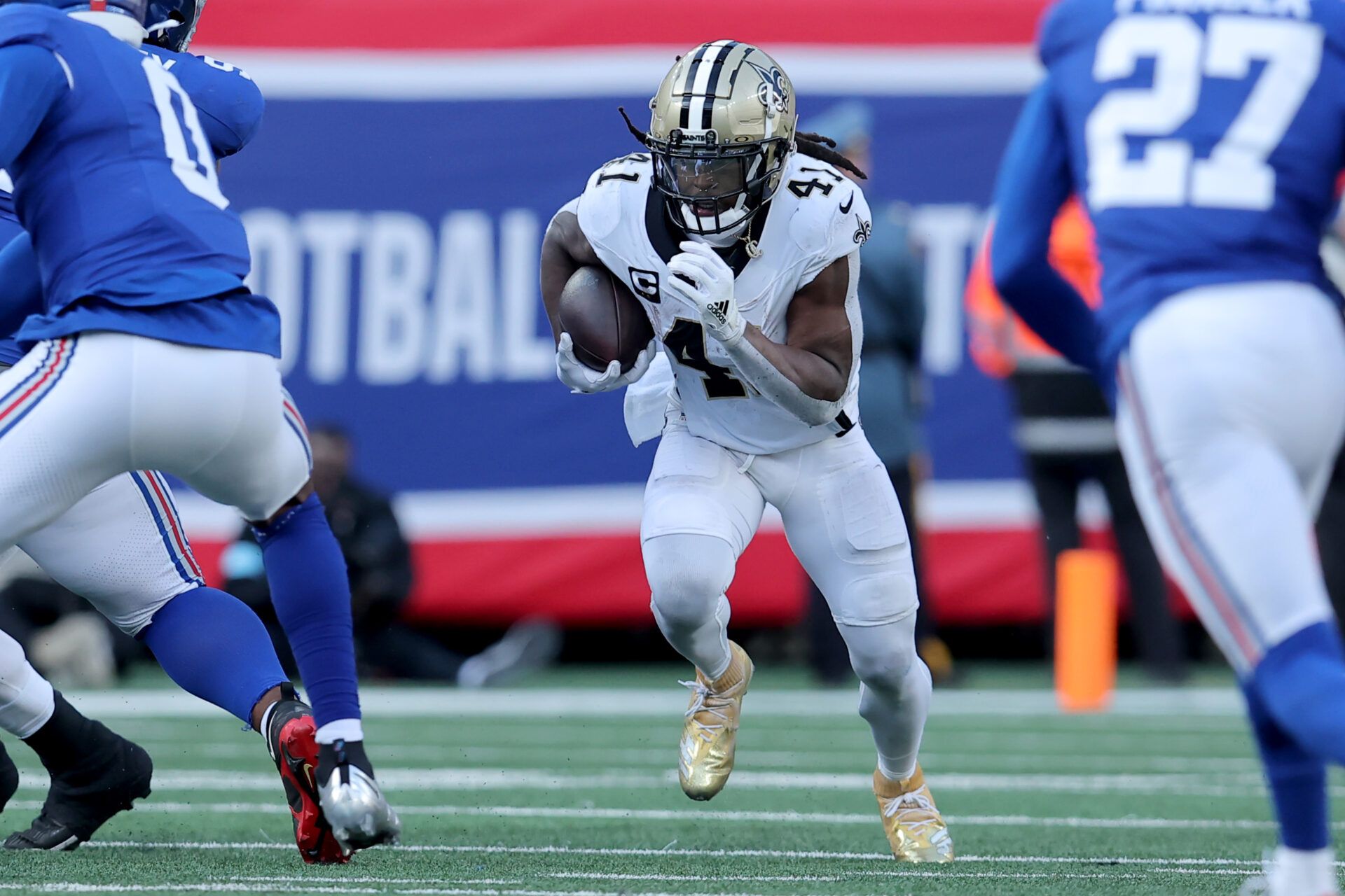 Dec 8, 2024; East Rutherford, New Jersey, USA; New Orleans Saints running back Alvin Kamara (41) runs with the ball against the New York Giants during the second quarter at MetLife Stadium. Mandatory Credit: Brad Penner-Imagn Images