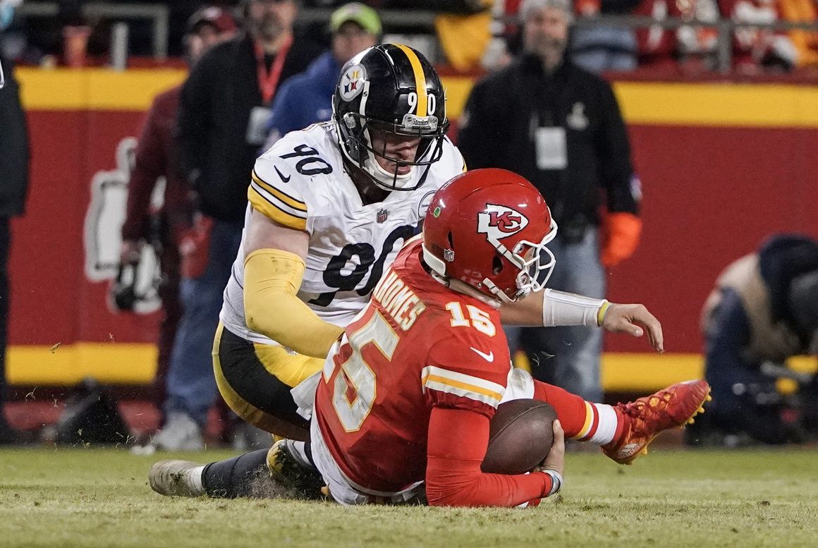 Kansas City Chiefs quarterback Patrick Mahomes (15) is sacked by Pittsburgh Steelers outside linebacker T.J. Watt (90) in an AFC Wild Card playoff football game at GEHA Field at Arrowhead Stadium.