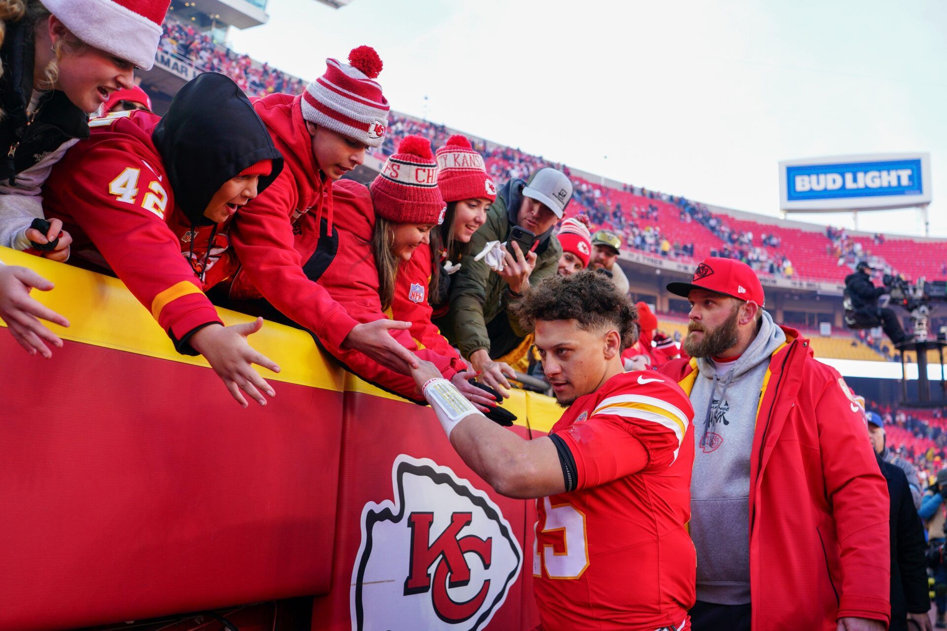 Kansas City Chiefs quarterback Patrick Mahomes (15) greets fans while leaving the stadium after the win over the Houston Texans at GEHA Field at Arrowhead Stadium.