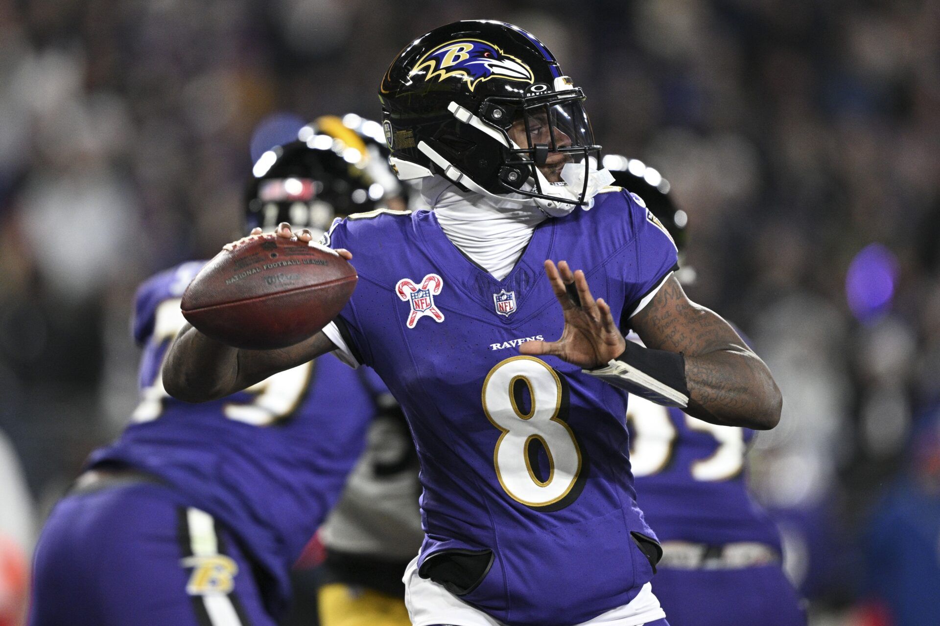 Baltimore Ravens quarterback Lamar Jackson (8) throws from the pocket during the first half against the Pittsburgh Steelers at M&T Bank Stadium.