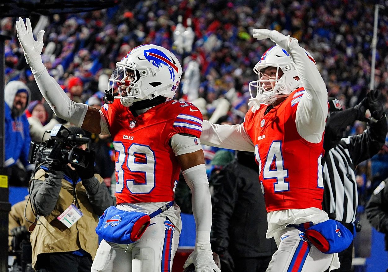 Buffalo Bills cornerback Cam Lewis (39) celebrates with teammate Buffalo Bills safety Cole Bishop (24) his interception during second half action at Highmark Stadium where the Buffalo Bills hosted the New England Patriots in Orchard Park on Dec. 22, 2024.