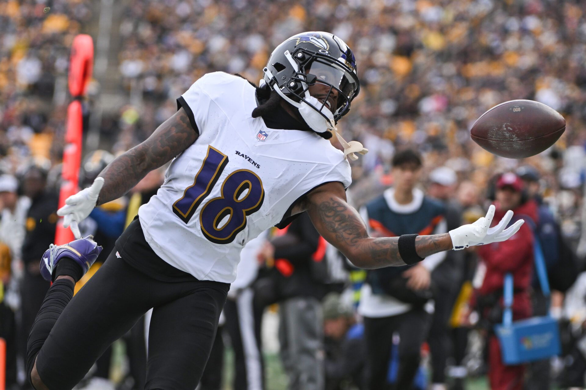 Nov 17, 2024; Pittsburgh, Pennsylvania, USA; Baltimore Ravens wide receiver Diontae Johnson (18) reaches for an incomplete pass against the Pittsburgh Steelers during the first quarter at Acrisure Stadium. Mandatory Credit: Barry Reeger-Imagn Images