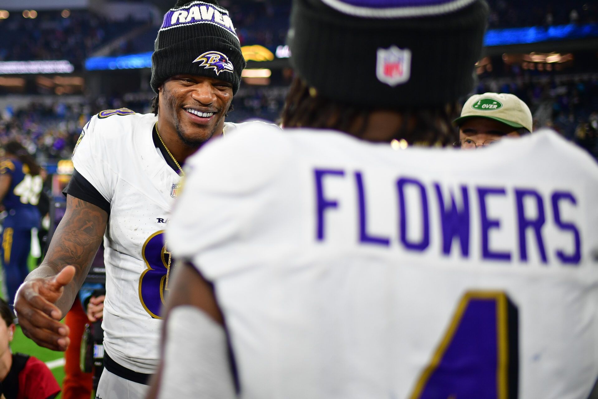 Nov 25, 2024; Inglewood, California, USA; Baltimore Ravens quarterback Lamar Jackson (8) is greeted by wide receiver Zay Flowers (4) following the victory against the Los Angeles Chargers at SoFi Stadium. Mandatory Credit: Gary A. Vasquez-Imagn Images