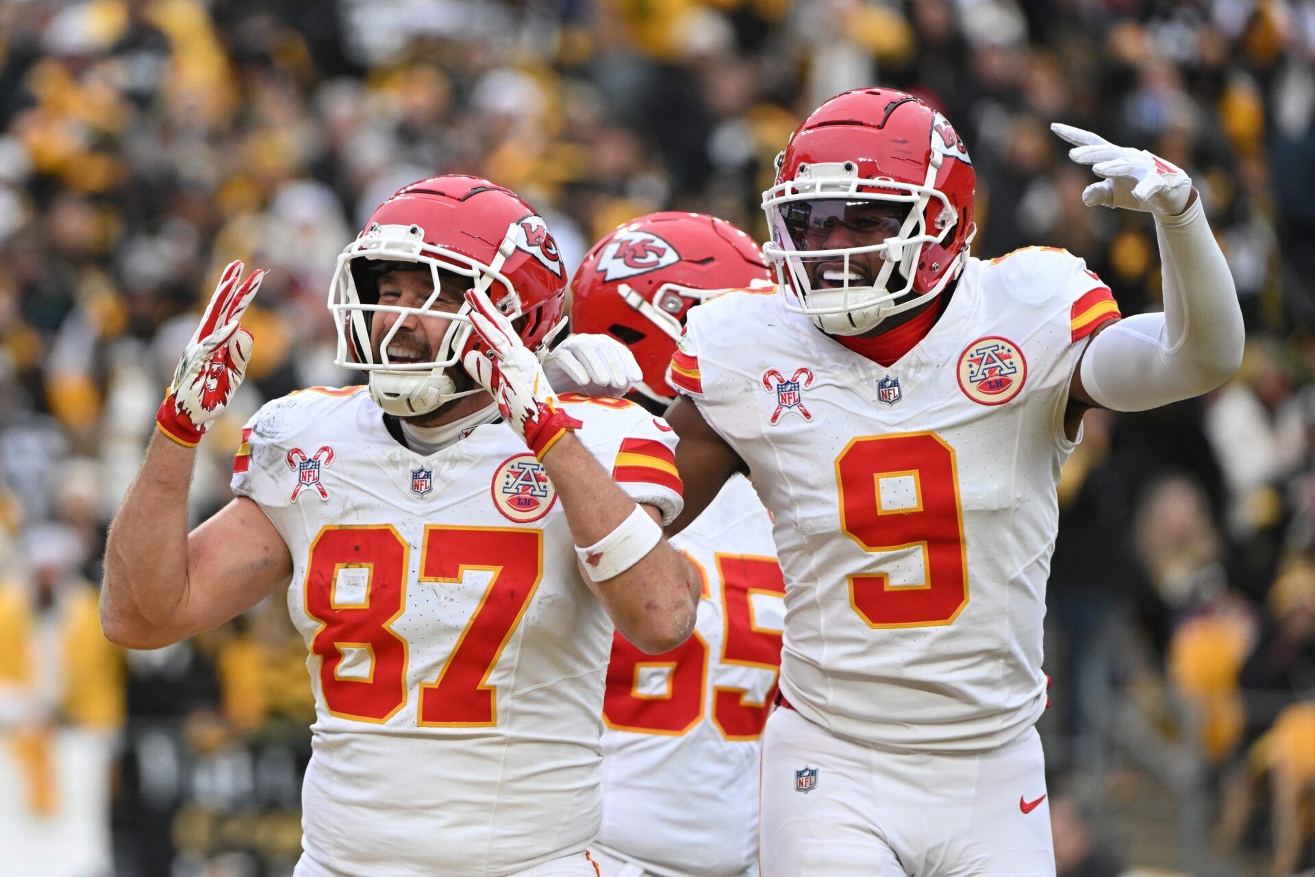 Kansas City Chiefs tight end Travis Kelce (87) celebrates a touchdown wide receiver JuJu Smith-Schuster (9) against the Pittsburgh Steelers during the second half at Acrisure Stadium.