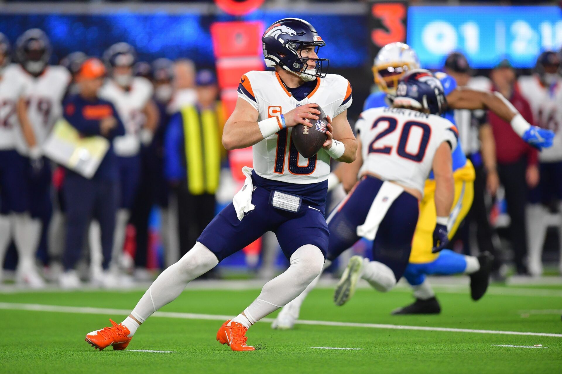 Denver Broncos quarterback Bo Nix (10) drops back to pass against the Los Angeles Chargers during the first half at SoFi Stadium.