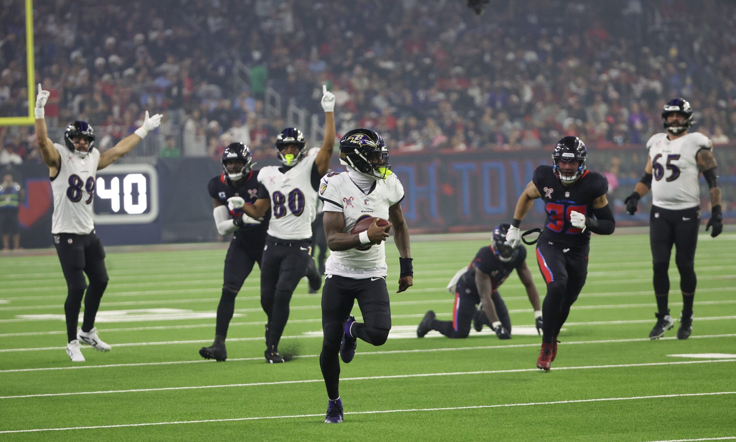 Baltimore Ravens quarterback Lamar Jackson (8) rushes for a 48 yard touchdown against the Houston Texans in the third quarter at NRG Stadium.