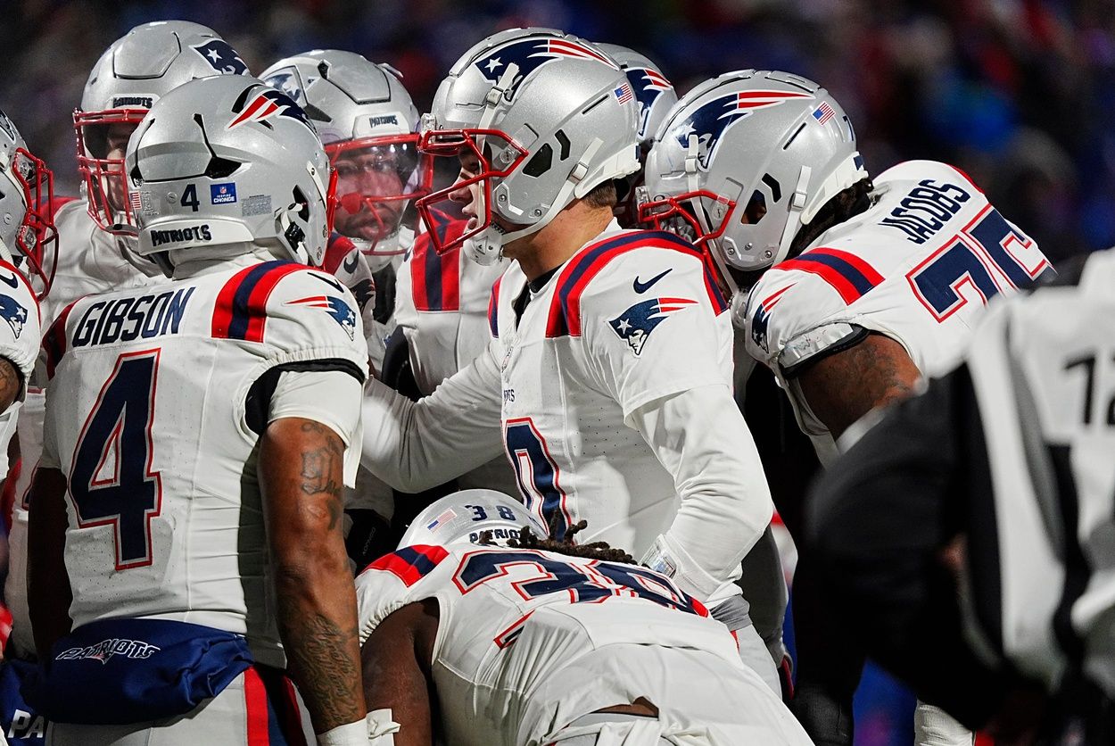 New England Patriots quarterback Drake Maye (10) talks to his offensive line in the huddle during second half action at Highmark Stadium where the Buffalo Bills hosted the New England Patriots in Orchard Park on Dec. 22, 2024.