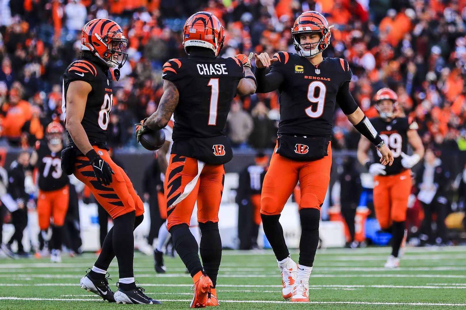 Cincinnati Bengals wide receiver Ja'Marr Chase (1) reacts with quarterback Joe Burrow (9) after scoring a touchdown in the second half against the Cleveland Browns at Paycor Stadium.