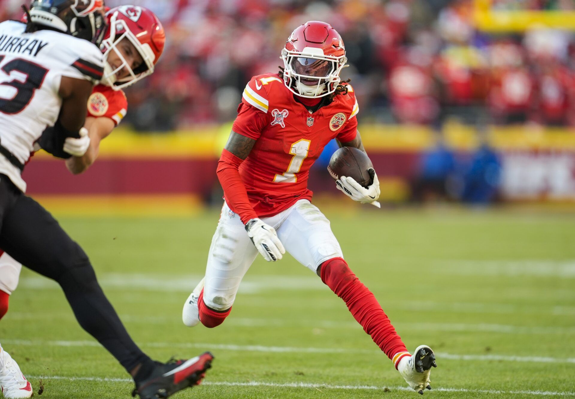 Kansas City Chiefs wide receiver Xavier Worthy (1) runs with the ball during the second half against the Kansas City Chiefs at GEHA Field at Arrowhead Stadium.