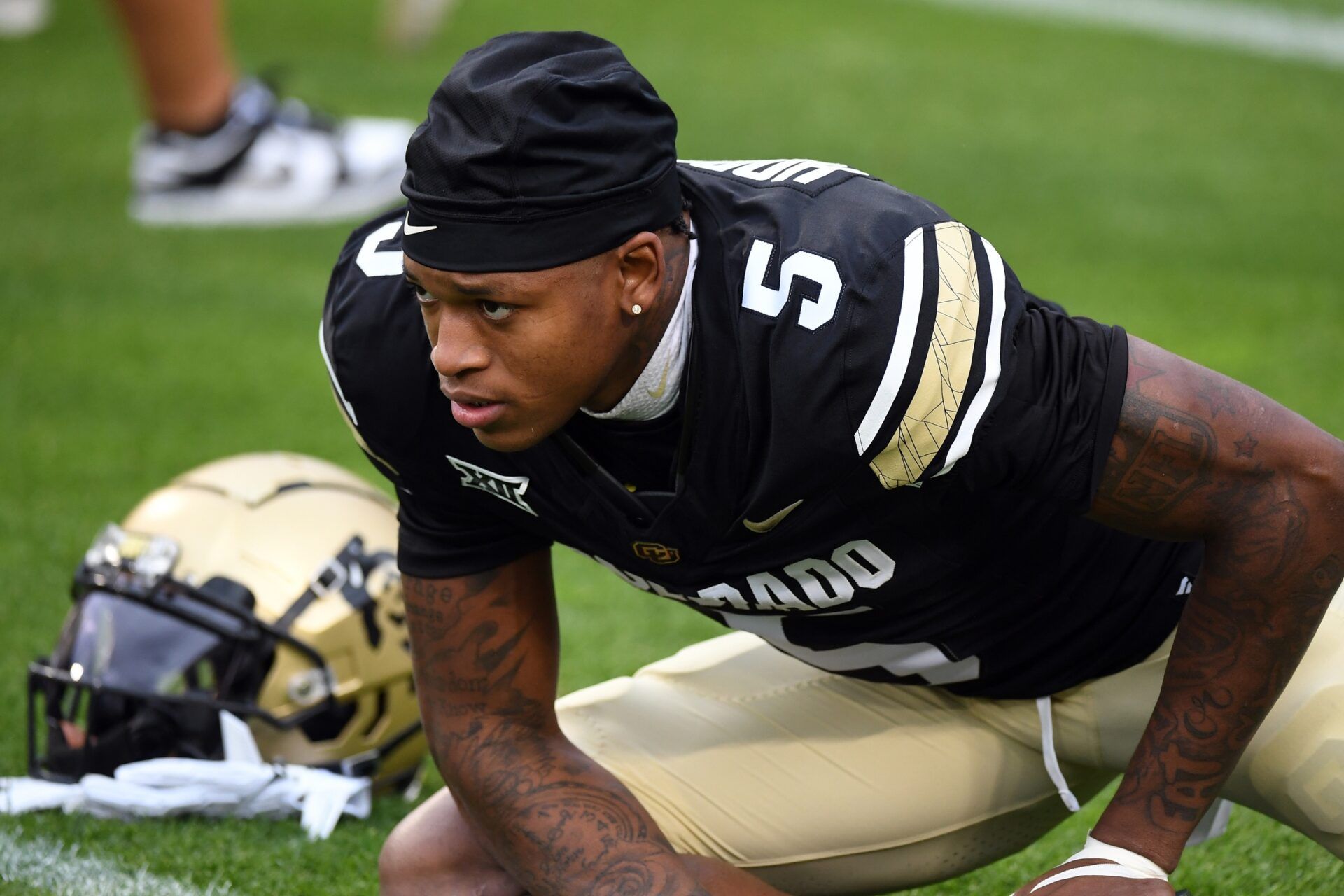 Colorado Buffaloes wide receiver Jimmy Horn Jr. (5) stretches before the game against the Baylor Bears at Folsom Field.