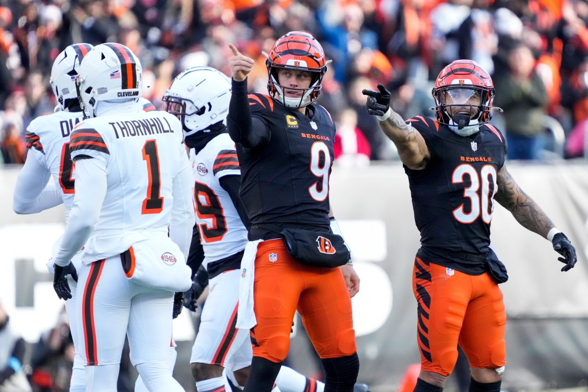 Cincinnati Bengals quarterback Joe Burrow (9) and running back Chase Brown (30) celebrate after a first down run by Burrow in the second quarter of the NFL Week 16 game between the Cincinnati Bengals and the Cleveland Browns at Paycor Stadium in downtown Cincinnati on Sunday, Dec. 22, 2024. The Bengals led 17-0 at halftime.