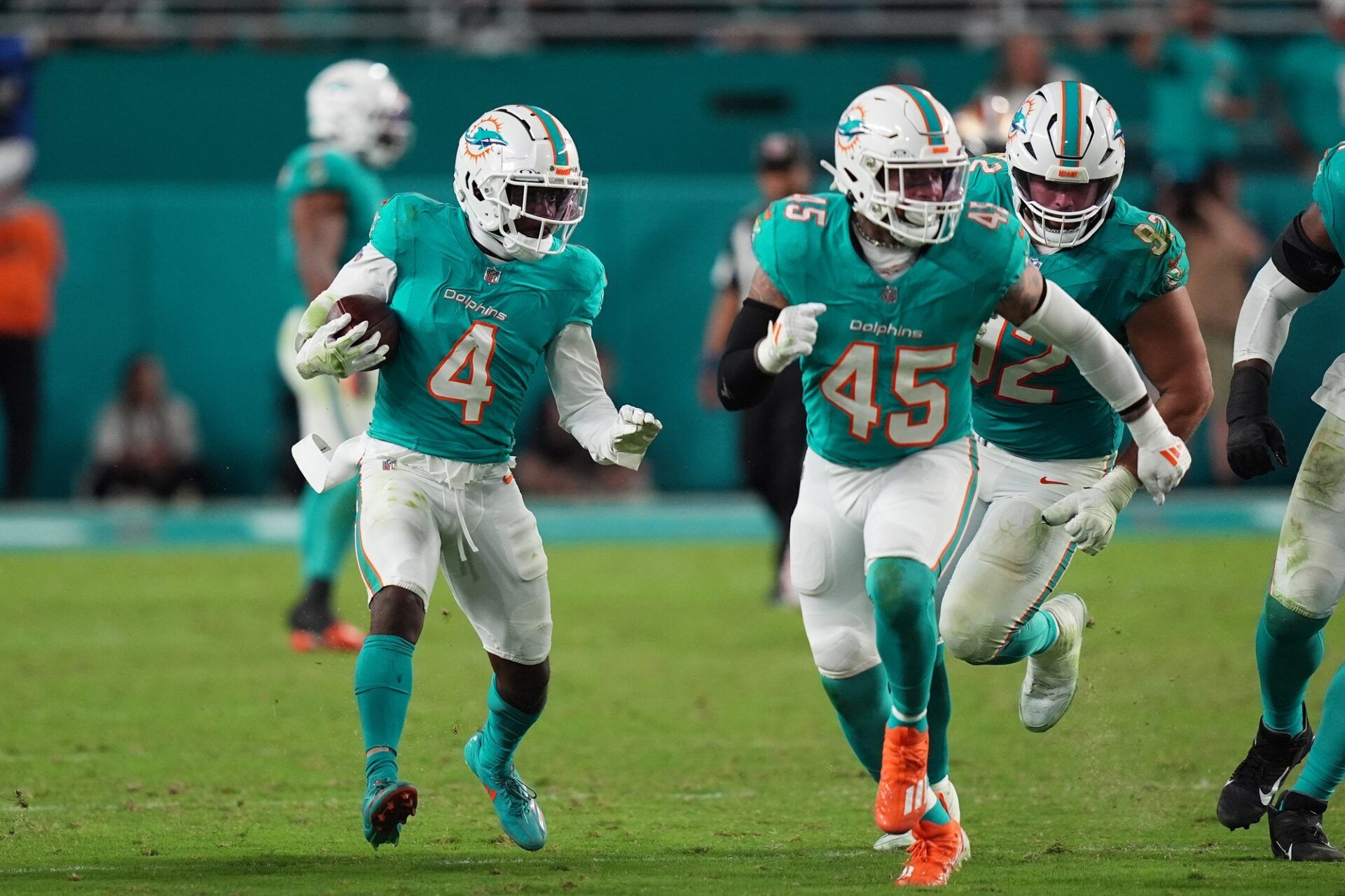 Miami Dolphins cornerback Kader Kohou (4) runs with the ball after intercepting a pass from San Francisco 49ers quarterback Brock Purdy (13, not pictured) during second half at Hard Rock Stadium.