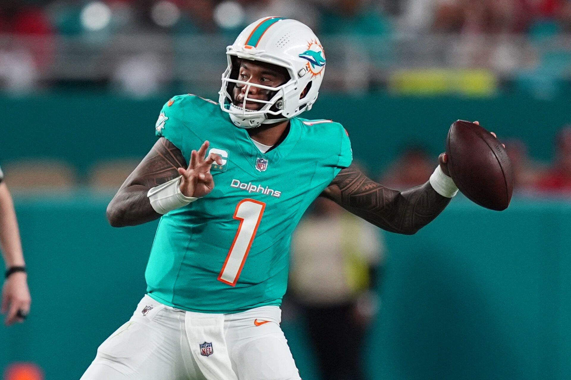 Dec 22, 2024; Miami Gardens, Florida, USA; Miami Dolphins quarterback Tua Tagovailoa (1) attempts a pass against the San Francisco 49ers during second half at Hard Rock Stadium. Mandatory Credit: Jasen Vinlove-Imagn Images