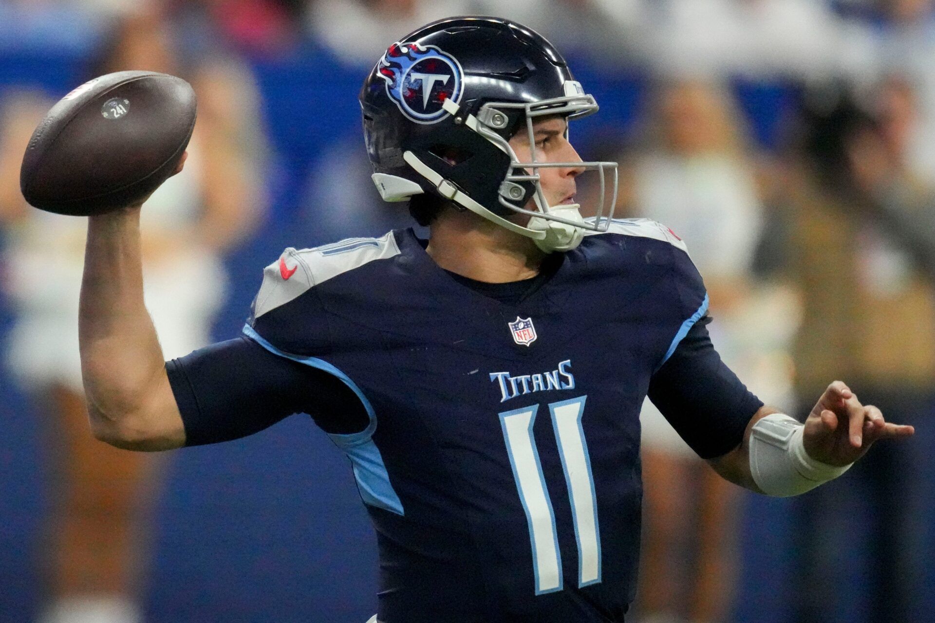 Tennessee Titans quarterback Mason Rudolph (11) draws back to pass Sunday, Dec. 22, 2024, during a game against the Indianapolis Colts at Lucas Oil Stadium in Indianapolis.