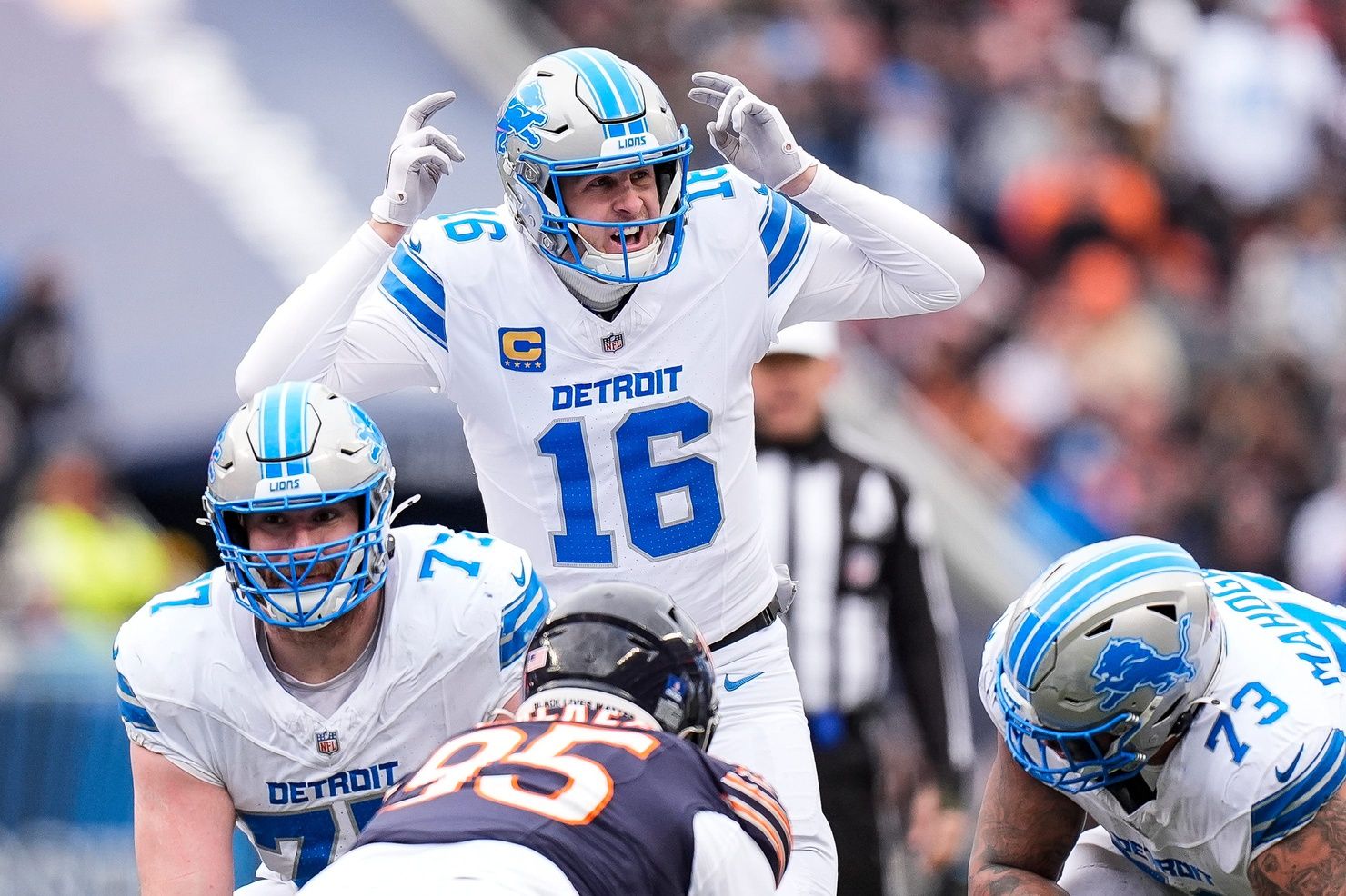 Detroit Lions quarterback Jared Goff (16) talks to teammates before a snap against Chicago Bears during the first half at Soldier Field in Chicago, Ill. on Sunday, Dec. 22, 2024.