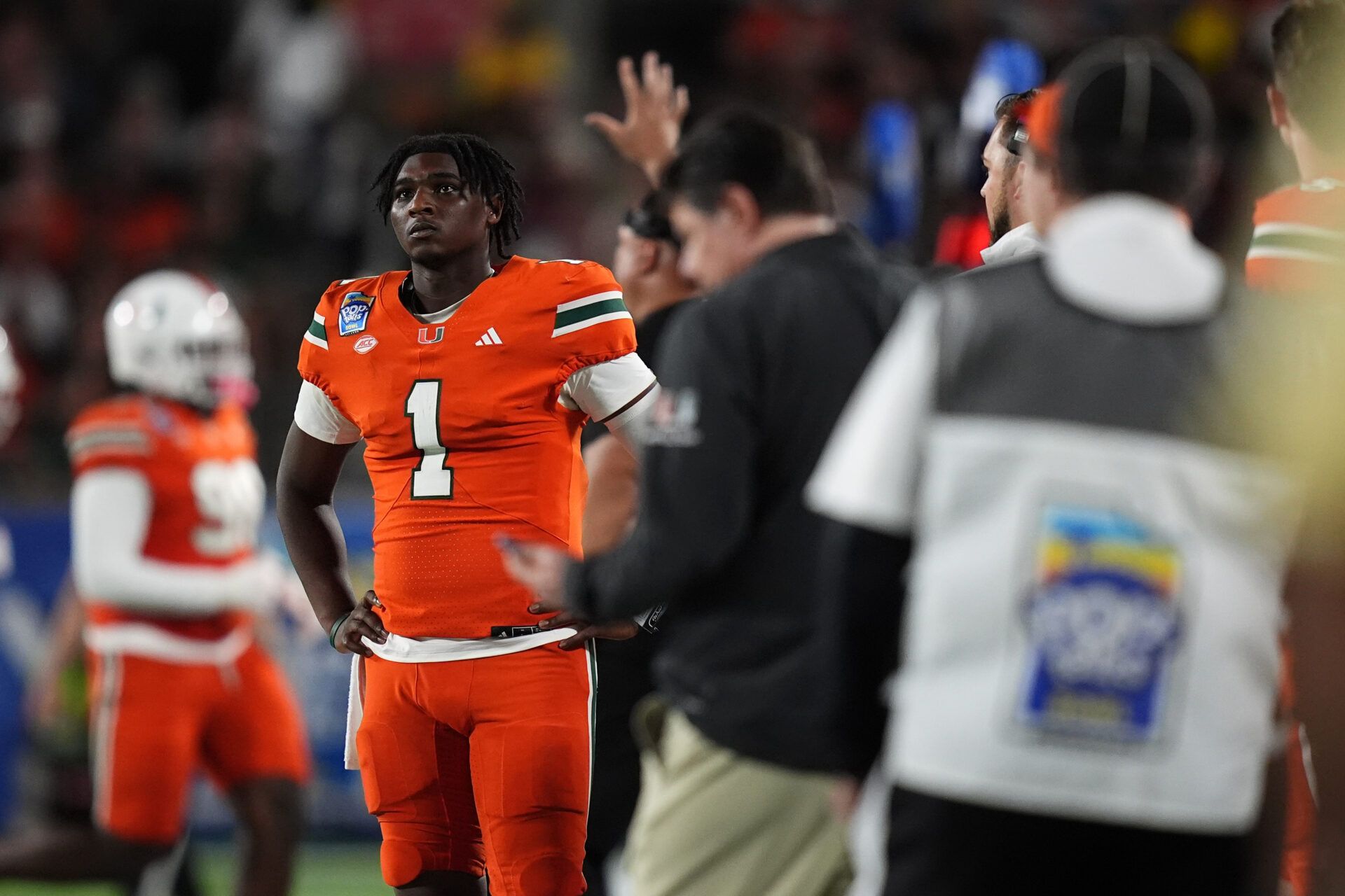 Dec 28, 2024; Orlando, FL, USA; Miami Hurricanes quarterback Cam Ward (1) looks up at the scoreboard during the second half against the Iowa State Cyclones at Camping World Stadium. Mandatory Credit: Jasen Vinlove-Imagn Images