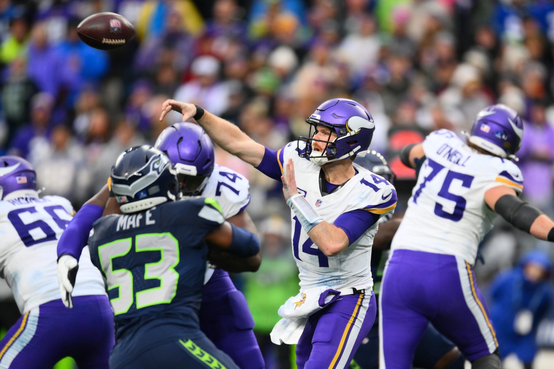 Minnesota Vikings quarterback Sam Darnold (14) passes the ball against the Seattle Seahawks during the second half at Lumen Field.